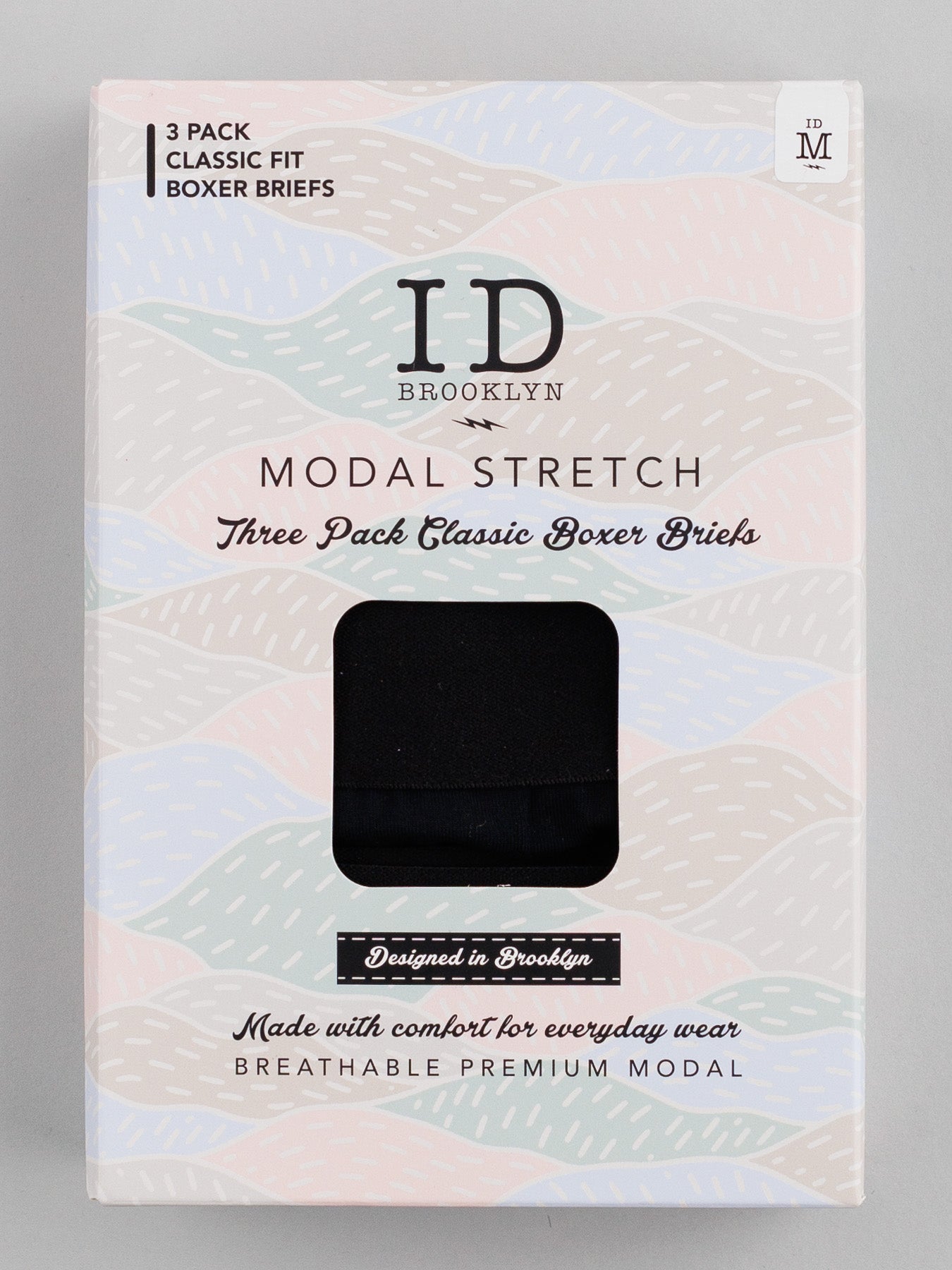 ID Menswear packaging features the ID Modal Boxer Briefs 3 Pack in a pastel abstract design. These classic fit briefs offer everyday comfort with breathable premium modal and stretch for ultimate ease.