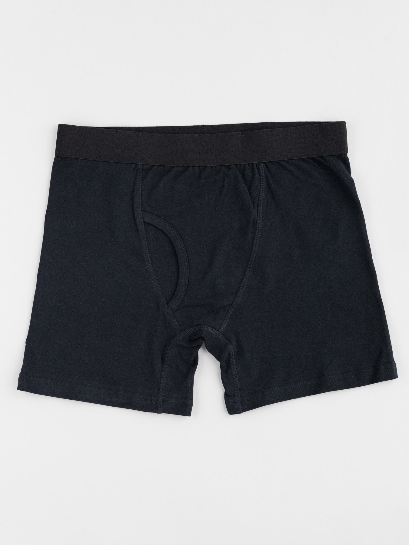 ID Menswears ID Organic Cotton Boxer Briefs 3 Pack offers black boxer briefs with a soft waistband and front fly, crafted from organic cotton for slight stretch. These everyday essentials blend comfort and style, photographed flat on a plain white background.