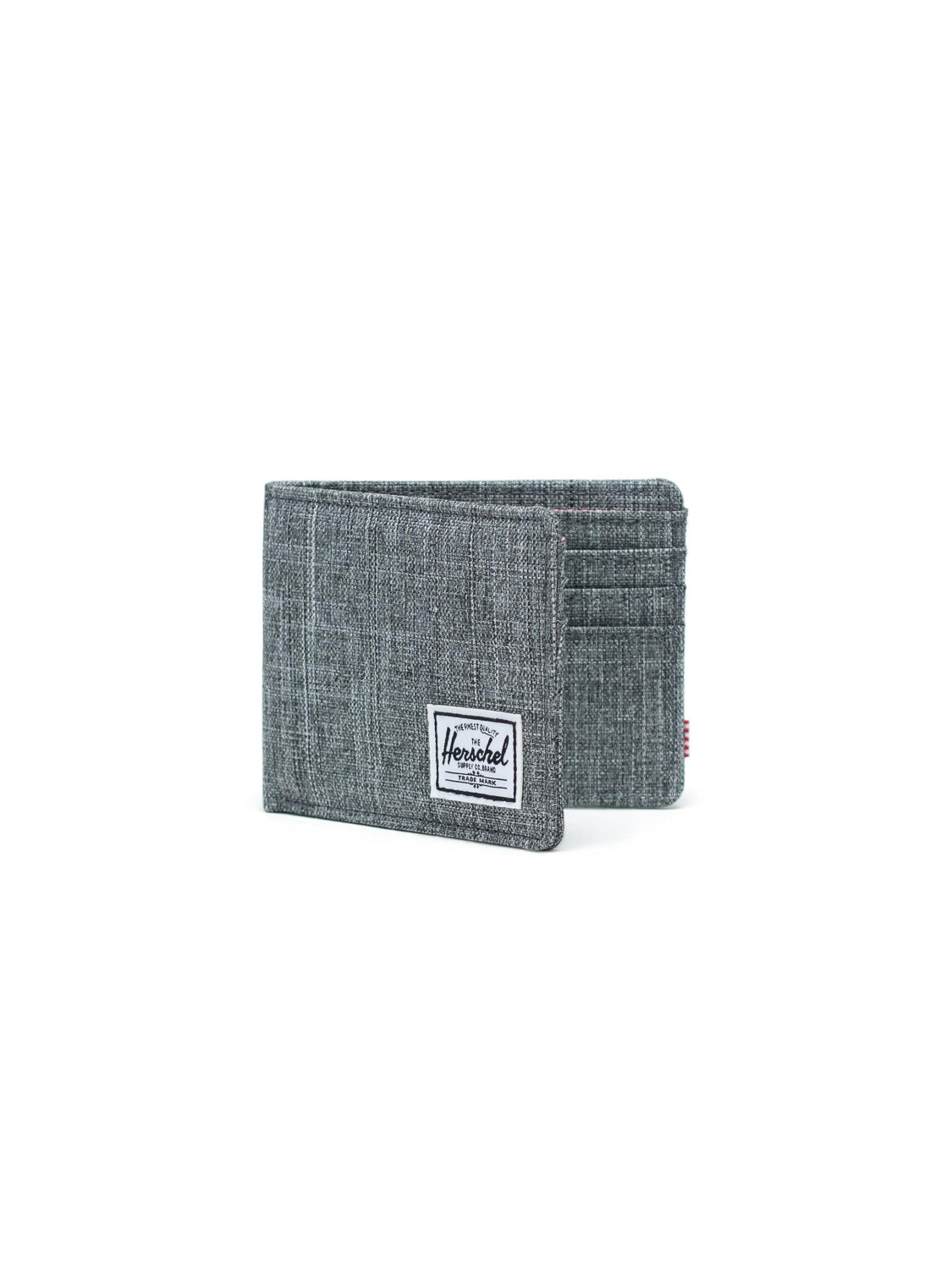 The Herschel Roy Classic Folded Wallet is a grey fabric wallet with a white rectangular logo patch on the front, multiple card slots, and a minimalist design, shown against a plain white background.