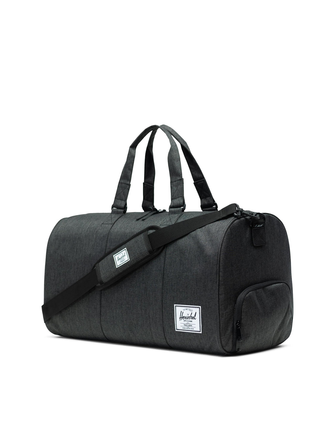 A dark gray Herschel Novel Weekender Duffle Bag featuring double handles, a detachable shoulder strap, a dedicated shoe compartment, and a white rectangular Herschel logo patch on the front pocket.