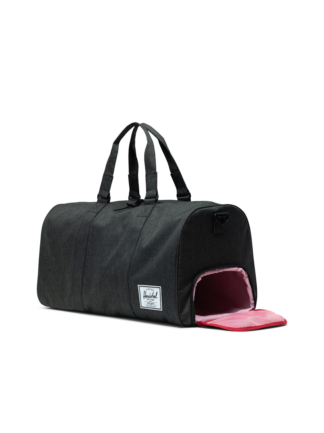 The Herschel Novel Weekender Duffle Bag is black with dual handles, a small side opening lined in pink for shoes, and features a white rectangular logo patch on the side.