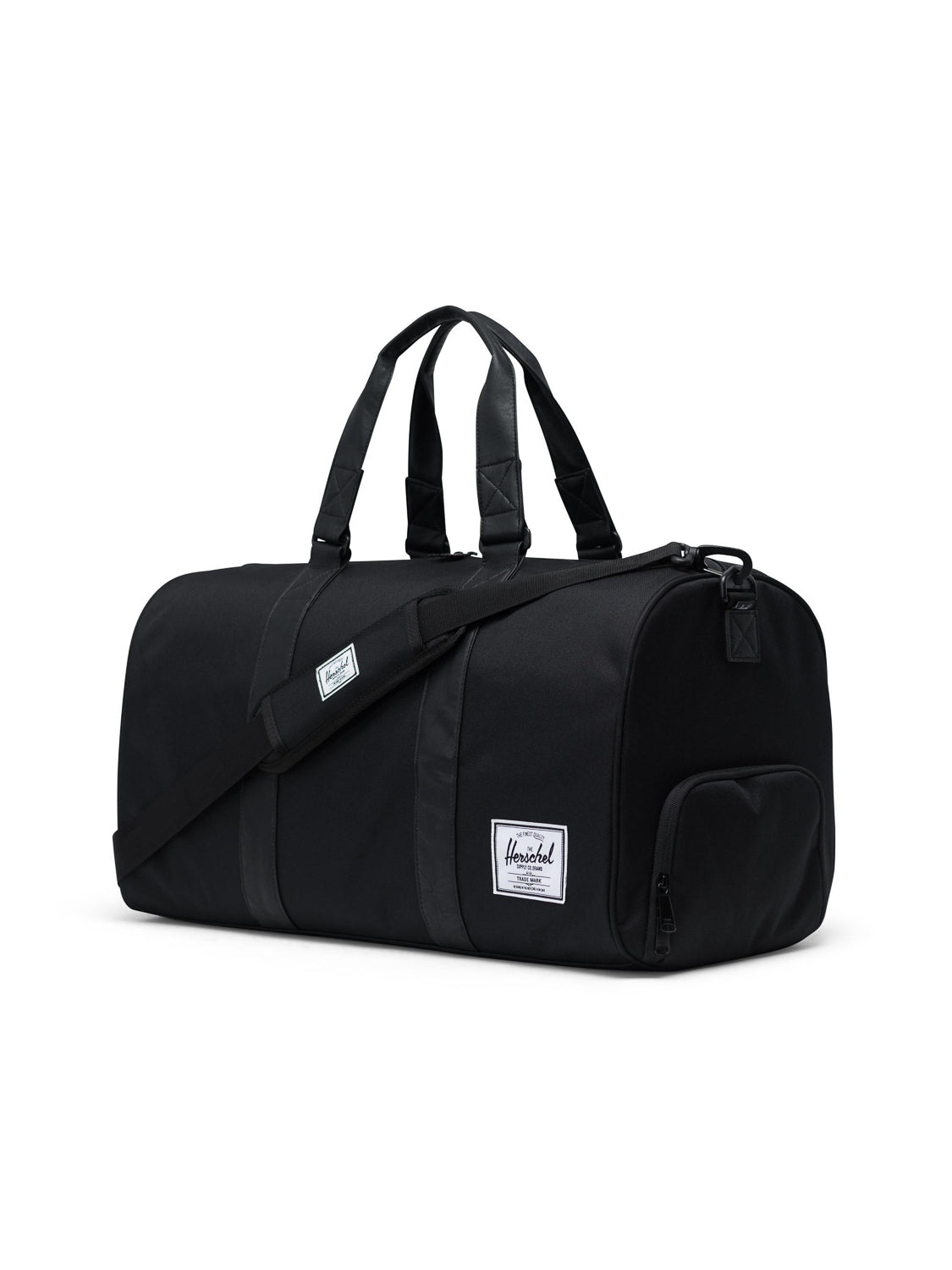 The Herschel Novel Weekender Duffle Bag in black features handles, a shoulder strap, a white rectangular logo patch, a zippered main compartment, side pocket, and a separate shoe compartment—ideal for stylish travel.