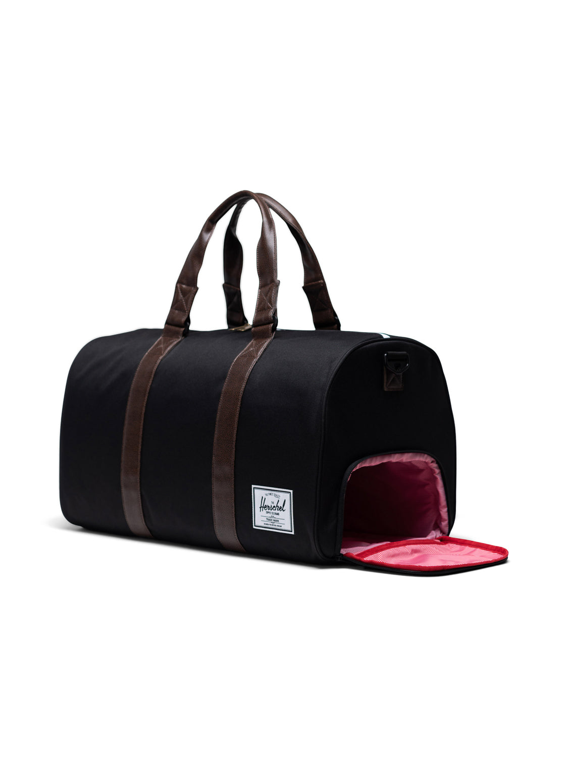 The Herschel Novel Weekender Duffle Bag in black features brown handles, a bright pink shoe compartment at one end, and a white Herschel logo patch—making it a stylish and practical choice for travel.