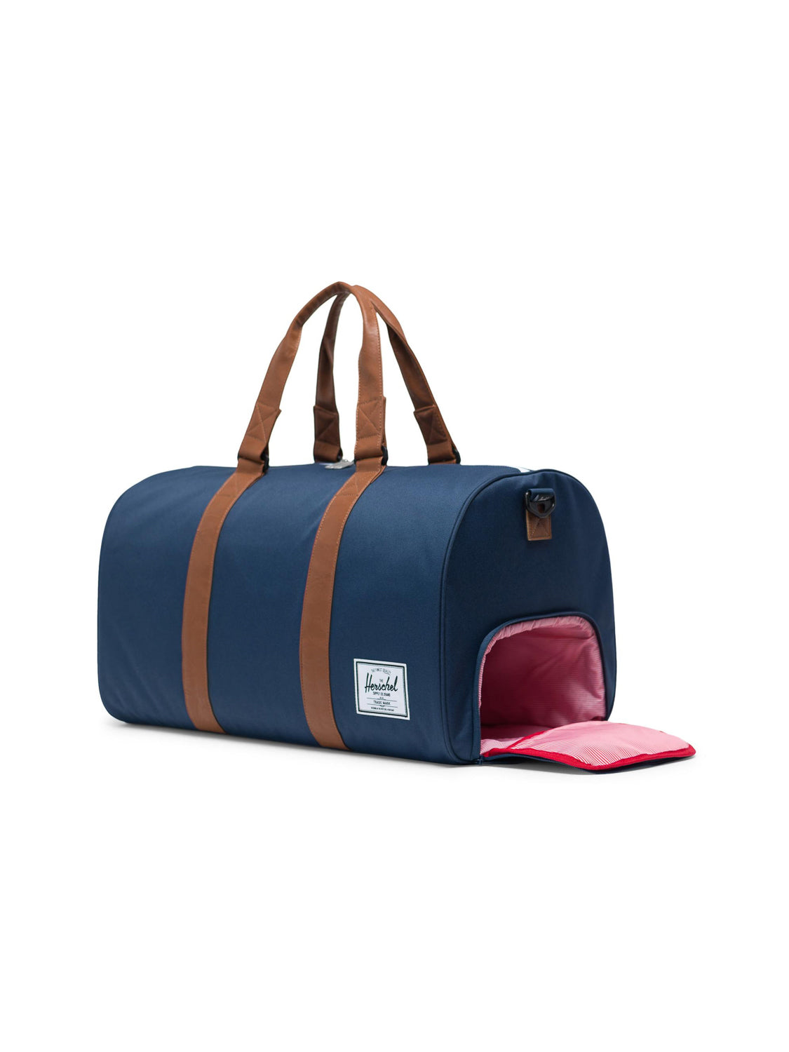 The Herschel Novel Weekender Duffle Bag features a navy blue design with brown handles and straps, a white rectangular side label, and a pink-lined zippered shoe compartment partially open at one end.
