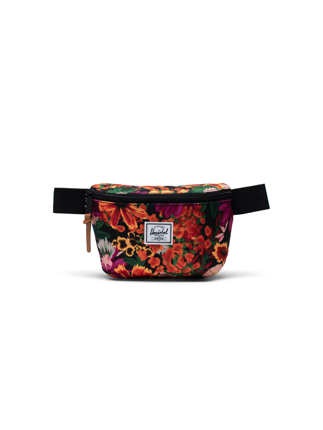 The Herschel Fourteen Hip Pack features a floral pattern, black adjustable strap, zippered main compartment with leather pull, and a white logo patch. Red, orange, and pink flowers make this essentials bag stand out.