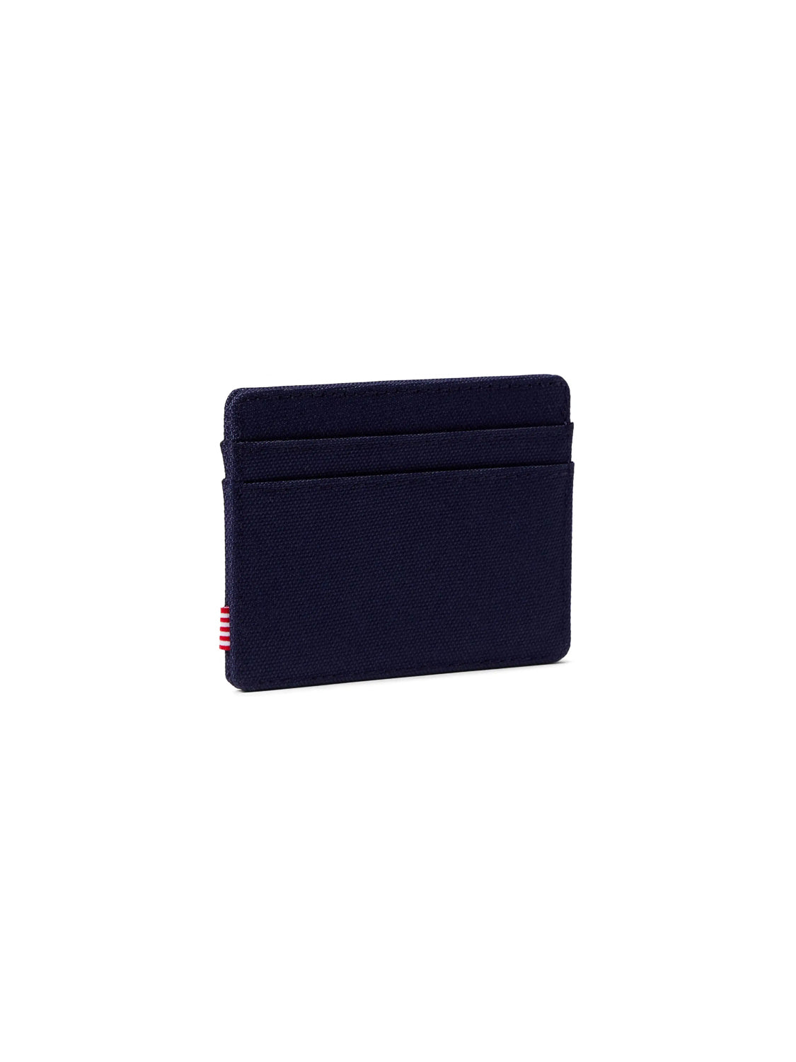 The Herschel Charlie Compact Card Holder Wallet is a slim, navy blue wallet with two visible card slots and a small red and white striped tag on the left side, displayed against a plain white background.