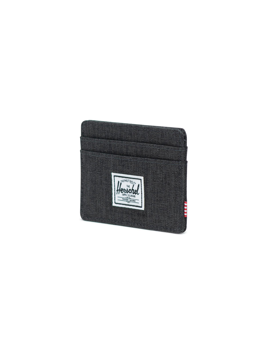 The Herschel Charlie Compact Card Holder Wallet is a black fabric wallet with two slots and a white rectangular Herschel label on the front, shown against a plain white background.