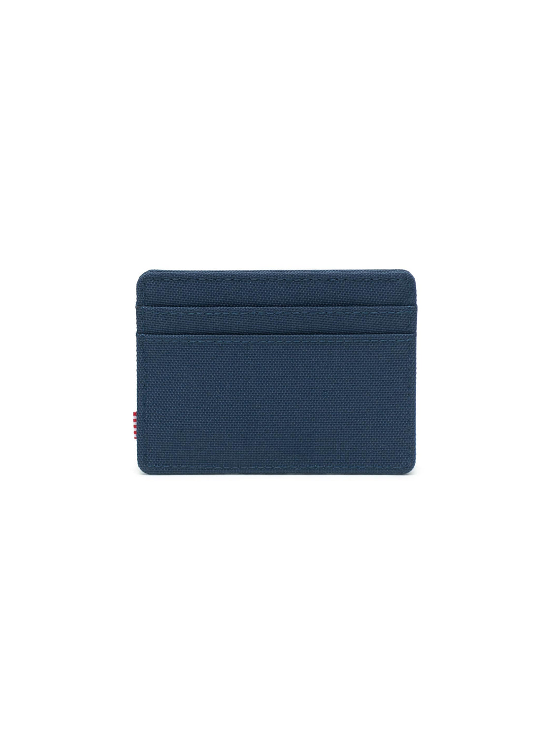 The Herschel Charlie Compact Card Holder Wallet is a minimalist navy blue fabric wallet with multiple front card slots, shown against a plain white background.