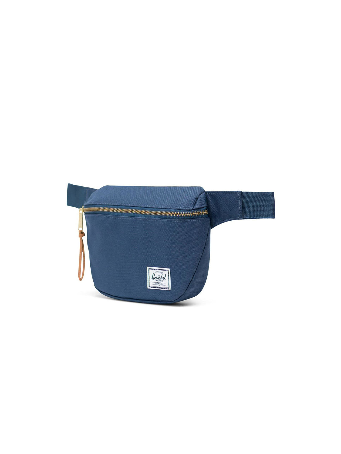 The Herschel Fifteen Hip Pack in blue features a metal zipper with a tan pull, an adjustable strap, and a white Herschel label on the front, shown on a white background.