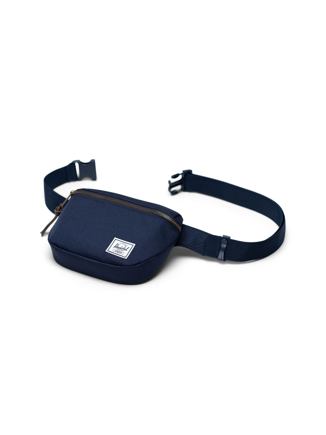 The Herschel Fifteen Hip Pack is a blue bag with a white logo, adjustable strap, and sleek metal zipper.