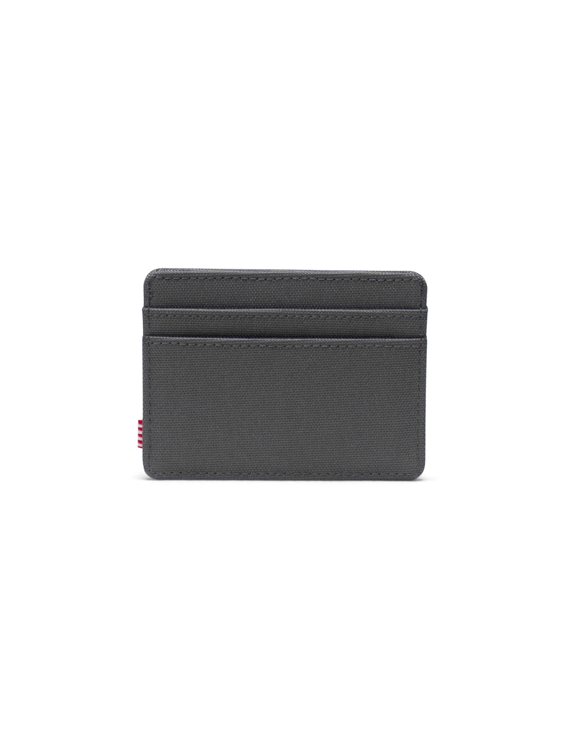 The Herschel Charlie Compact Card Holder Wallet features a minimalist dark gray design, multiple card slots, and a subtle red stitched detail on the left edge, displayed against a white background.