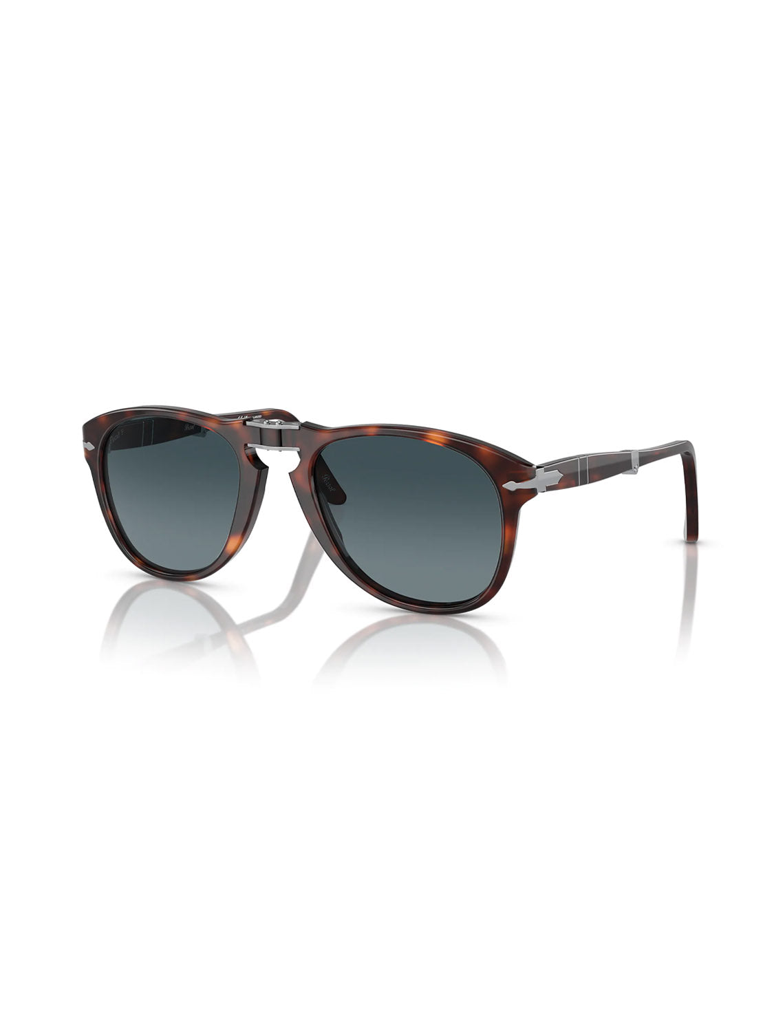 The Persol - PO714 sunglasses feature a dark tortoiseshell acetate frame, crystal polarized lenses, metallic hinge accents, and slim temples. They are stylishly displayed at an angle on a white background.