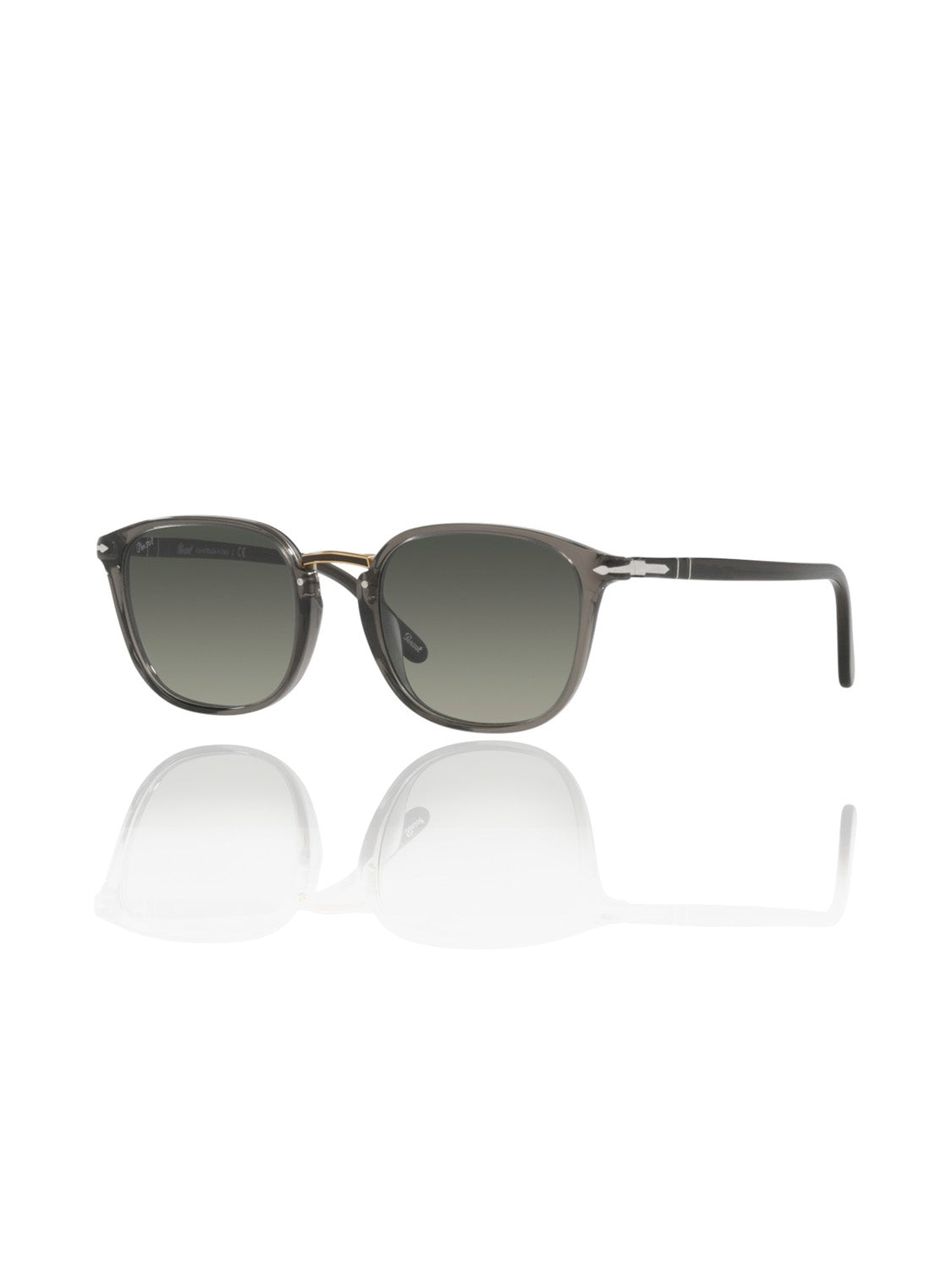 A pair of Persol PO3186 sunglasses with translucent gray lenses reflect on a white surface. The rectangular acetate frames feature a sleek design, enhanced by the Meflecto system for superior comfort.
