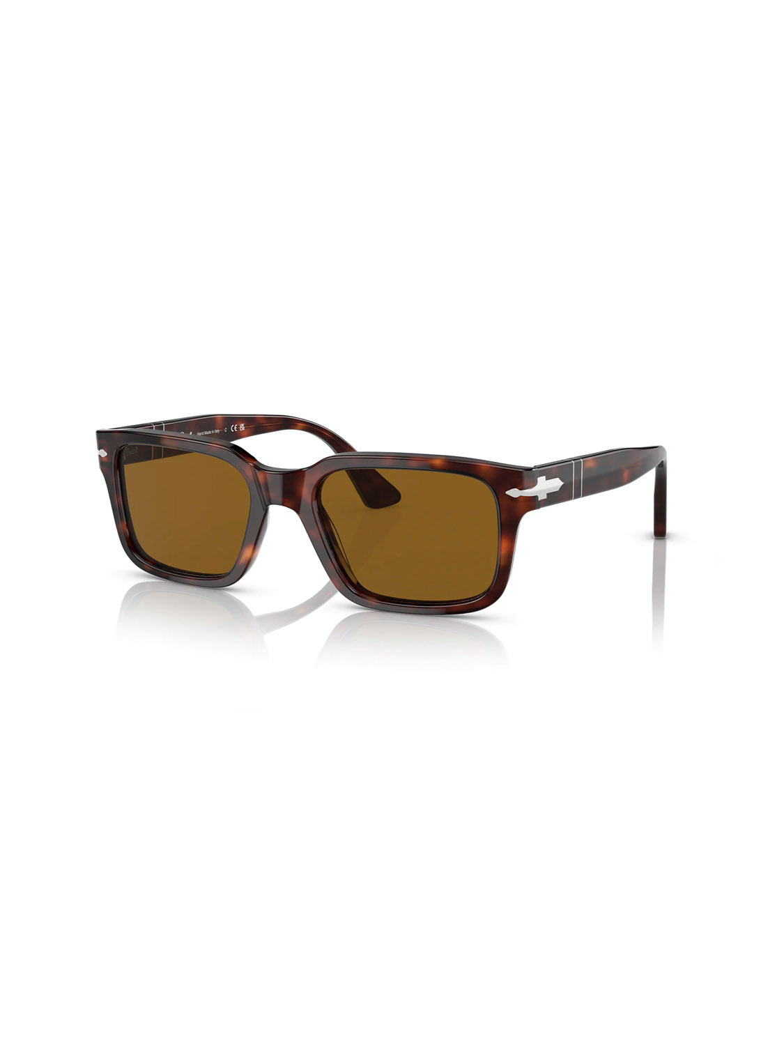 The Persol PO3272 sunglasses feature a tortoiseshell D-frame with dark brown lenses and silver accents on the arms, elegantly resting on a white reflective surface.