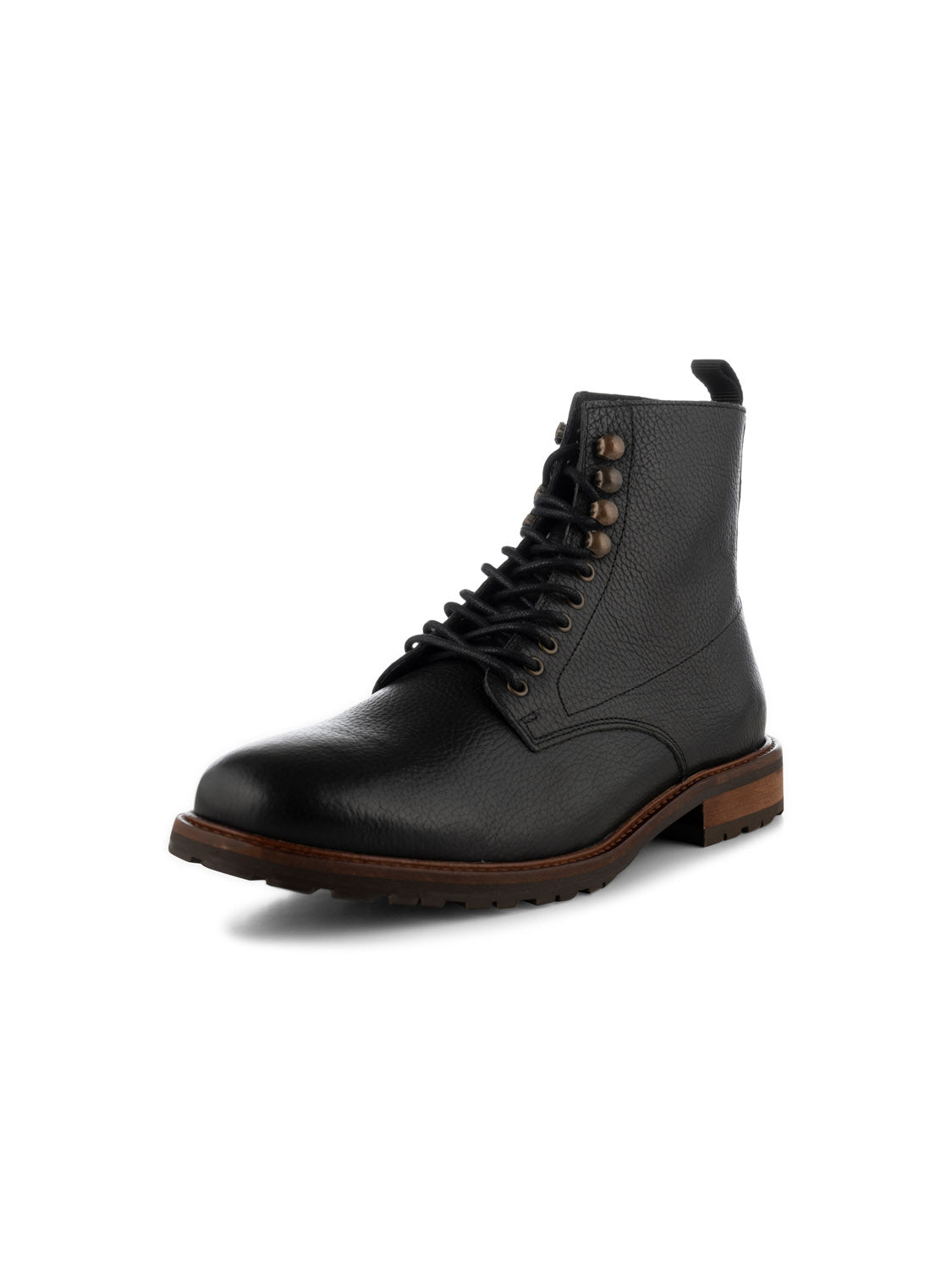 The York Lace Up Leather Boot by Shoe The Bear is a black leather ankle boot with a lace-up design and metal eyelets, crafted in Portugal using LWG-certified leather. It features a brown sole with textured tread, slight heel, and round toe for a sleek, minimalist style.
