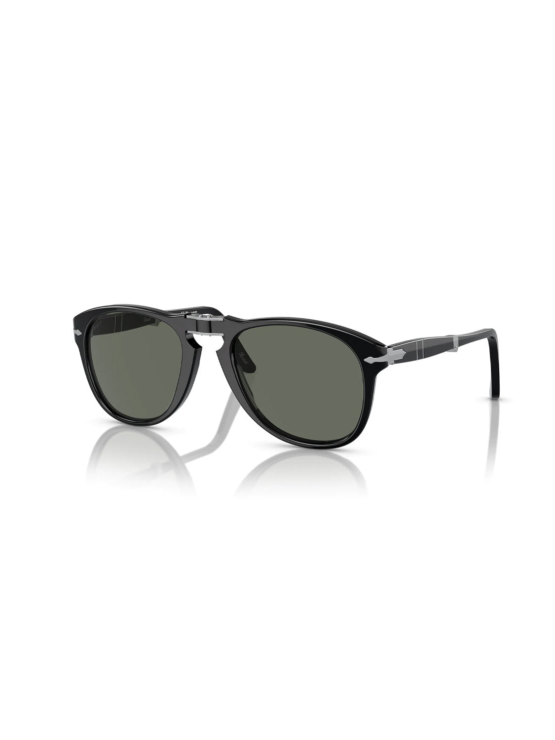 The Persol - PO714 features black acetate frames with dark polarized lenses, shown on a white backdrop casting a soft shadow. The sunglasses arms angle outward slightly.