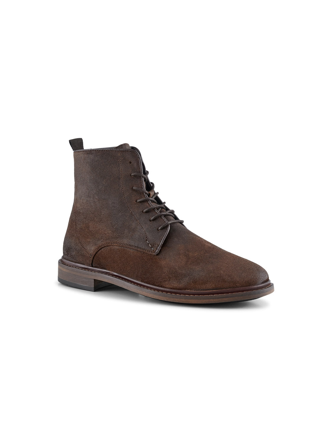 The Ned Suede Waxed Boot by Shoe The Bear is a handmade brown waxed suede lace-up with rounded toes, flat sole, slightly raised heel, and dark brown laces through metal eyelets. It includes a rear pull tab and is crafted in Portugal against a white backdrop.