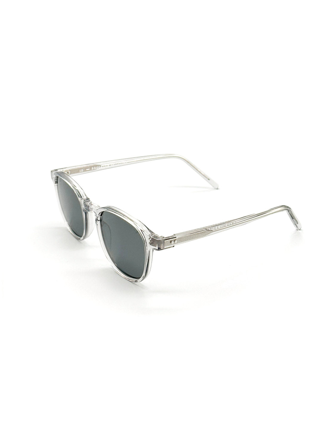 The A144C3G ID Polarized Sunglasses by ID Menswear feature clear frames, round dark CR39 polarized lenses, slender arms, and UV400 protection. Shown on a white background.