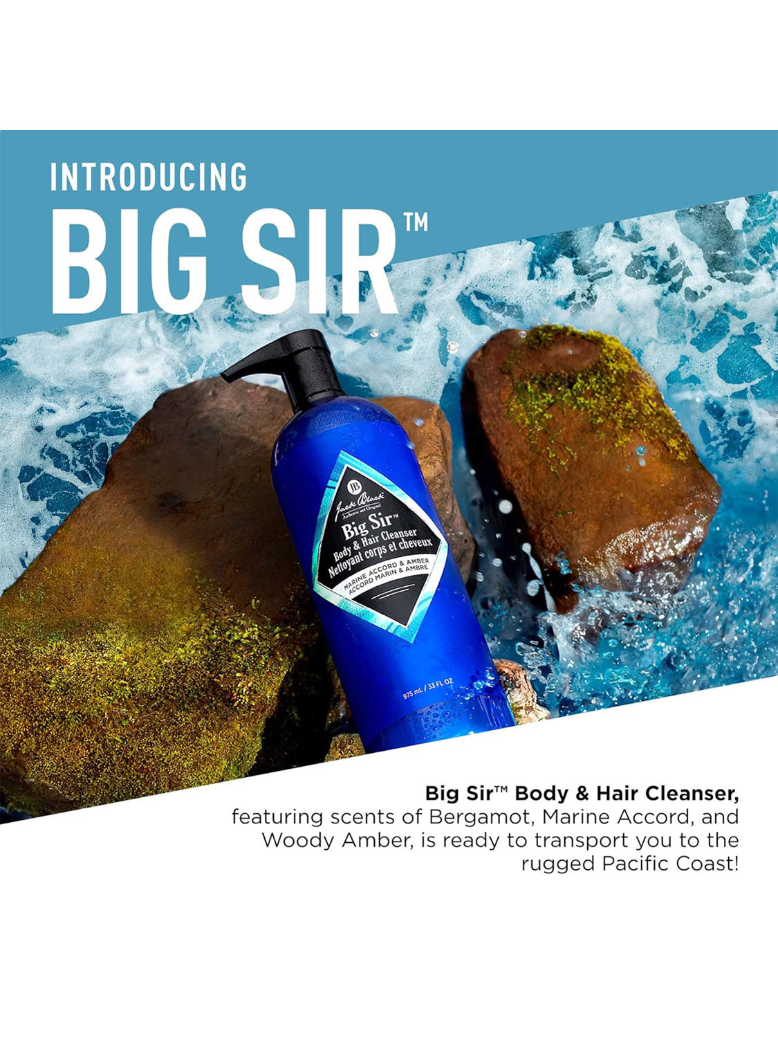 A blue bottle of Jack Black Body and Hair Cleanser rests on mossy rocks by the sea, waves splashing behind. This aromatic cleanser blends coastal scents of bergamot, marine accord, and woody amber.
