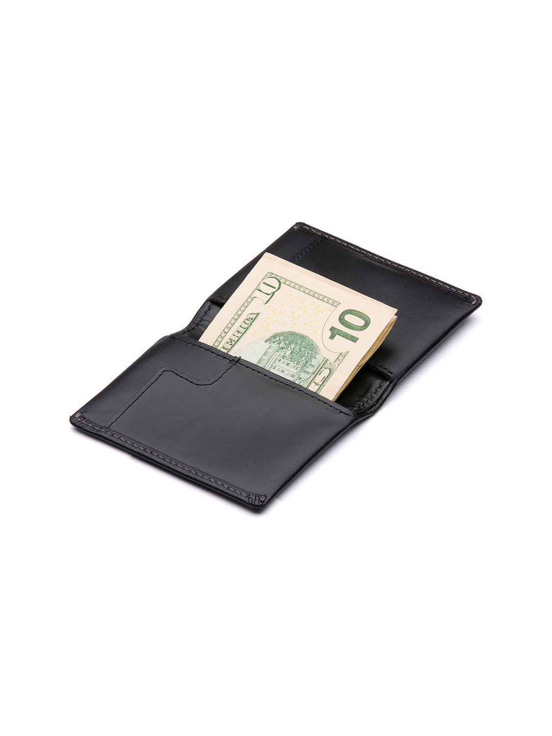 A Bellroy Slim Sleeve Wallet in black leather lies open on a white surface, displaying a ten-dollar bill partially tucked into one of its compartments.