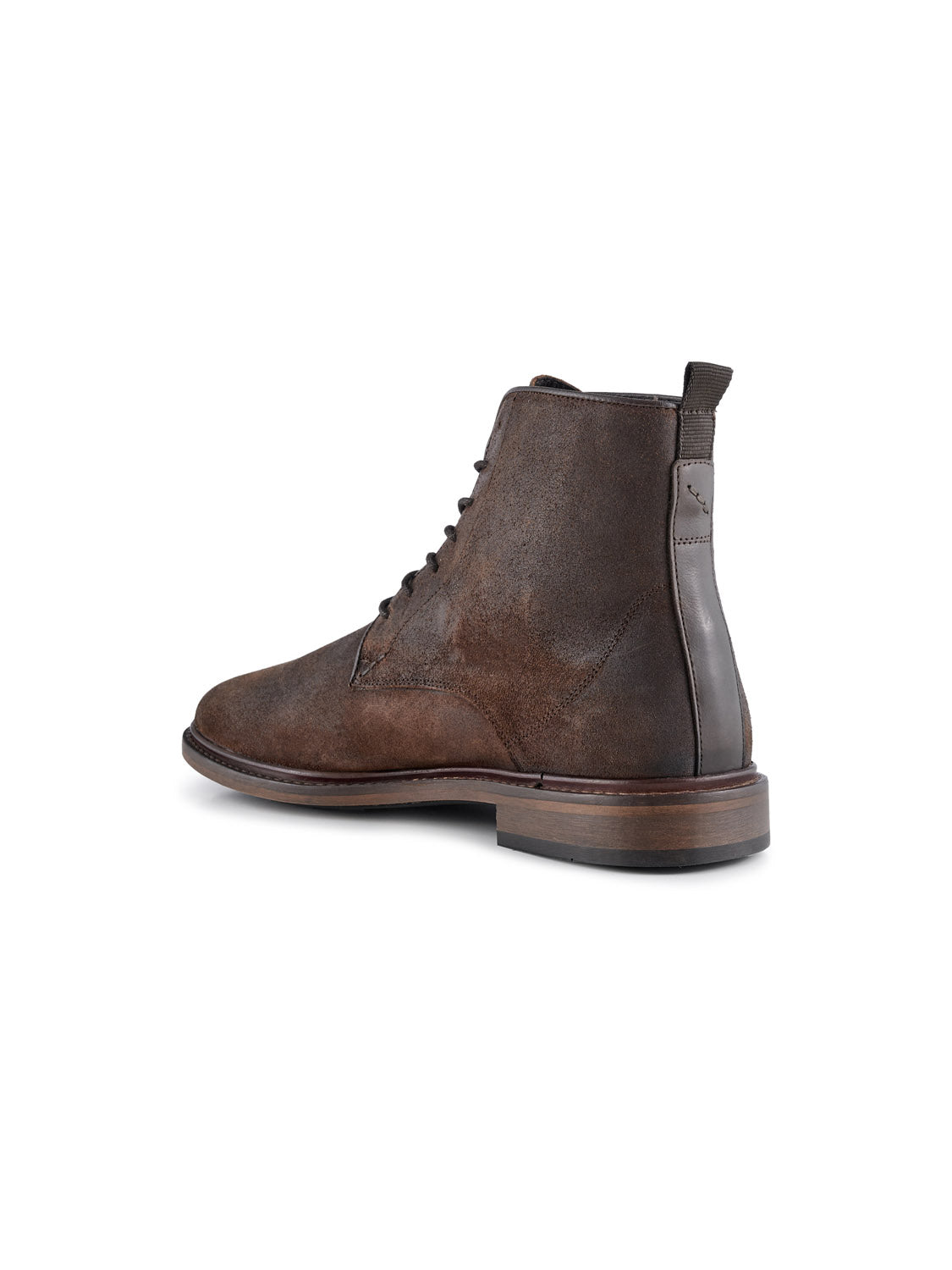 The Ned Suede Waxed Boot by Shoe The Bear is a handmade ankle boot from Portugal featuring a brown waxed suede finish, laces, a wooden sole, and a dark back strap for easy pull-on. It boasts a textured and rugged look.