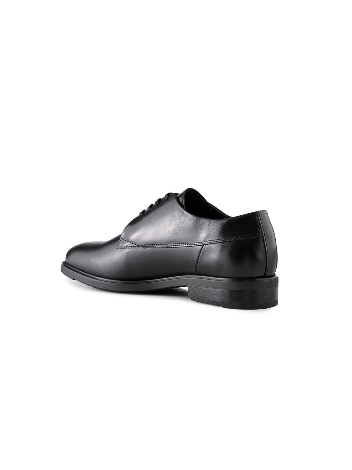 The Linea Derby Style by Shoe The Bear is a black leather dress shoe crafted from LWG-certified leather. Its minimalist design features a low heel, sleek silhouette, lace-up closure, and polished finish, viewed from the back and side against a plain white background.