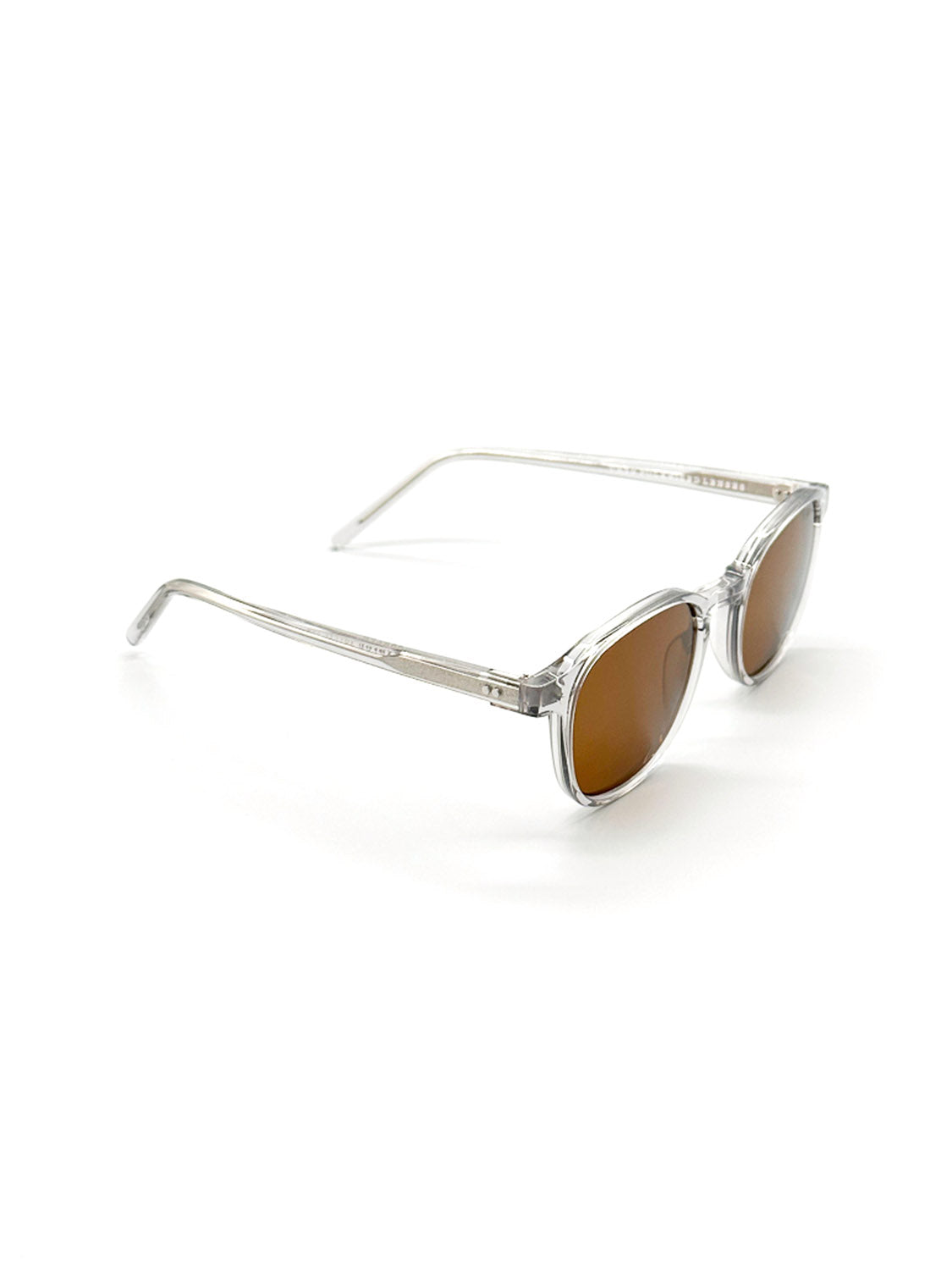The A144C3B ID Polarized Sunglasses by ID Menswear feature clear frames and brown-tinted CR39 polarized lenses, shown angled on a white background to display both the side and front views.