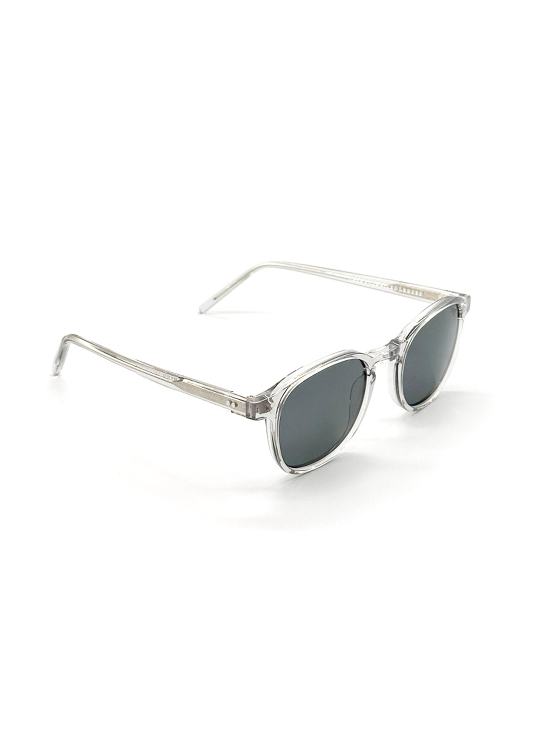 ID Menswears A144C3G ID Polarized Sunglasses feature clear frames with round dark lenses, made from Mazzucchelli Acetate and offering UV400 protection, shown at an angle on a white background.