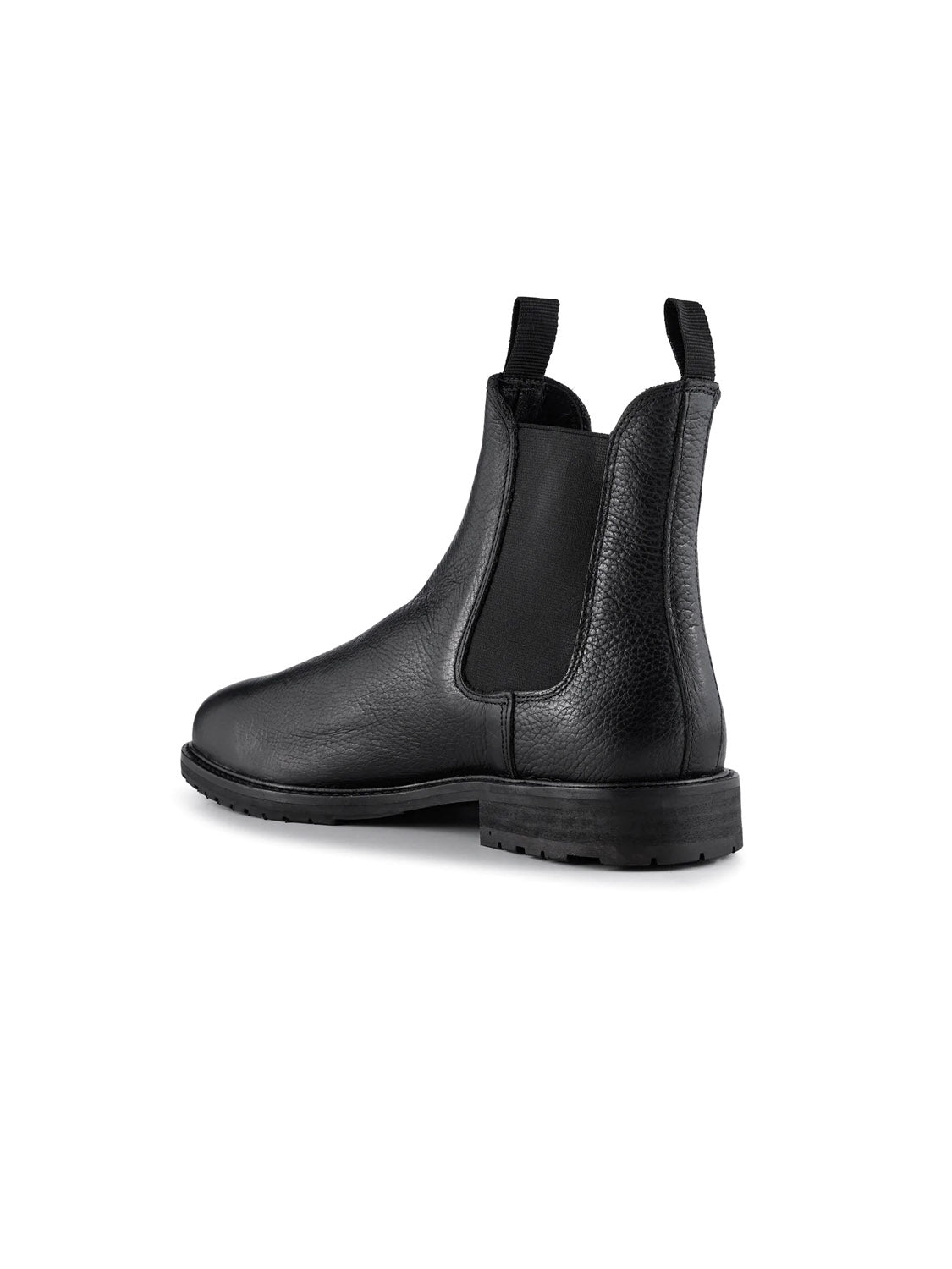 A York Classic Chelsea Boot by Shoe The Bear is displayed from a three-quarter rear angle. Made in Portugal from LWG-certified black leather, it features an elastic side panel, pull tab, and low black rubber heel on a plain white background.