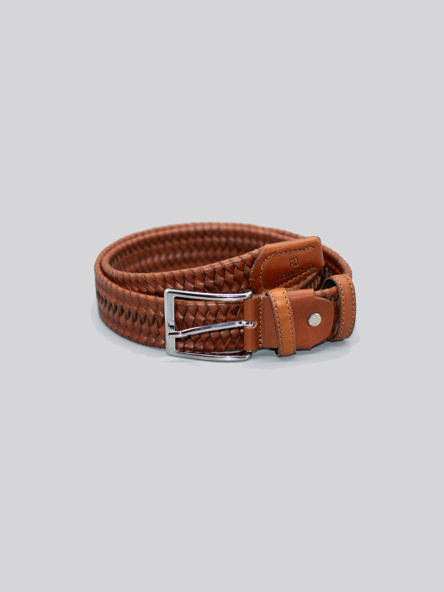 The 4558 Made in Italy Braided Leather Belt by ID Menswear features brown genuine leather, silver buckle, leather end accents, and is shown coiled on a plain light gray background.