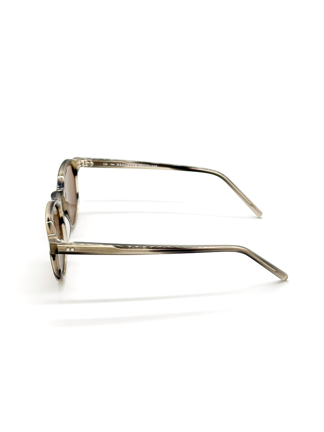 Side view of A144C36B ID Polarized Sunglasses by ID Menswear, featuring transparent brown Mazzucchelli Acetate frames and tinted CR39 polarized lenses. Slim, gently curved arms enhance comfort. Displayed against a white background.