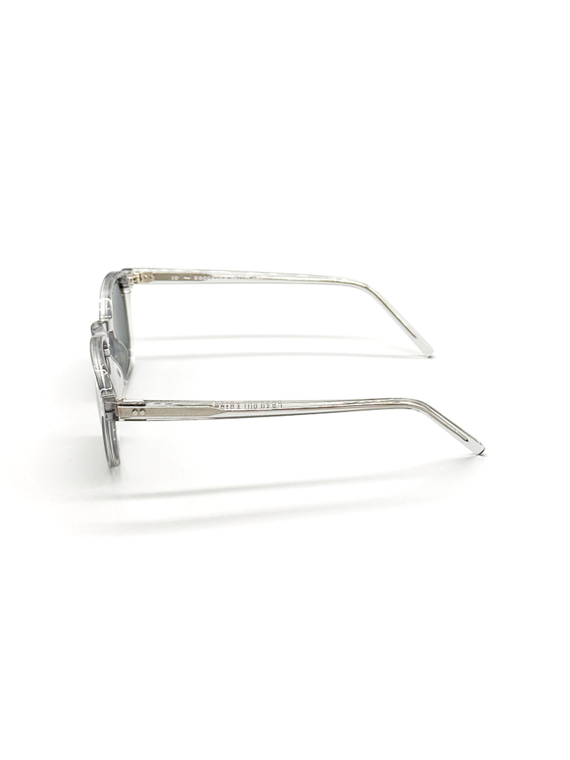 The A144C3G ID Polarized Sunglasses by ID Menswear are shown from the side with clear Mazzucchelli Acetate arms, silver hinges, and CR39 polarized lenses providing UV400 protection, all set against a white background.