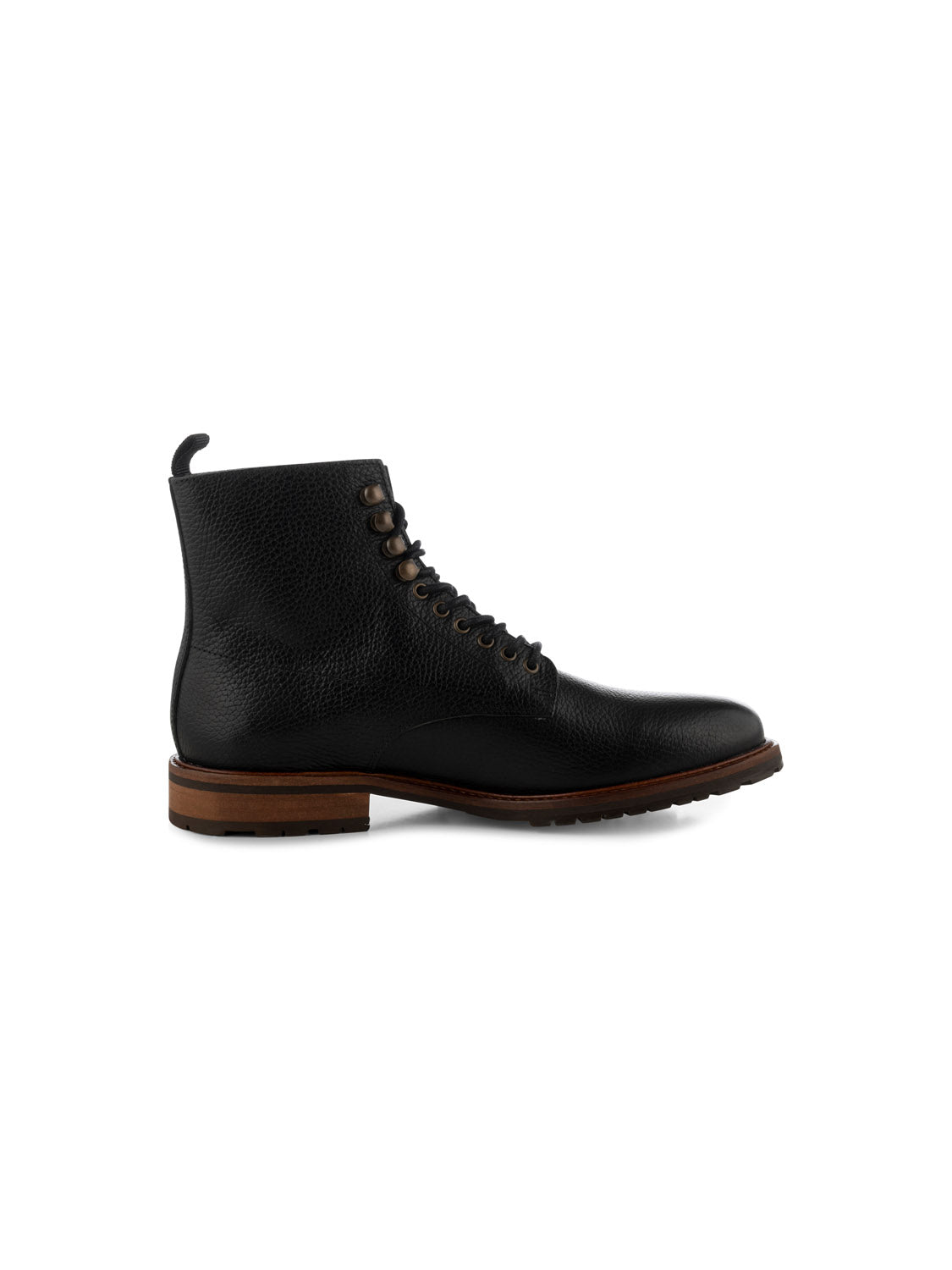 A side view of the York Lace Up Leather Boot by Shoe The Bear showcases its black handcrafted LWG-certified leather with brass eyelets, a brown wooden sole, dark rubber tread, and a pull tab at the back. Photographed against a plain white background, these boots are made in Portugal.