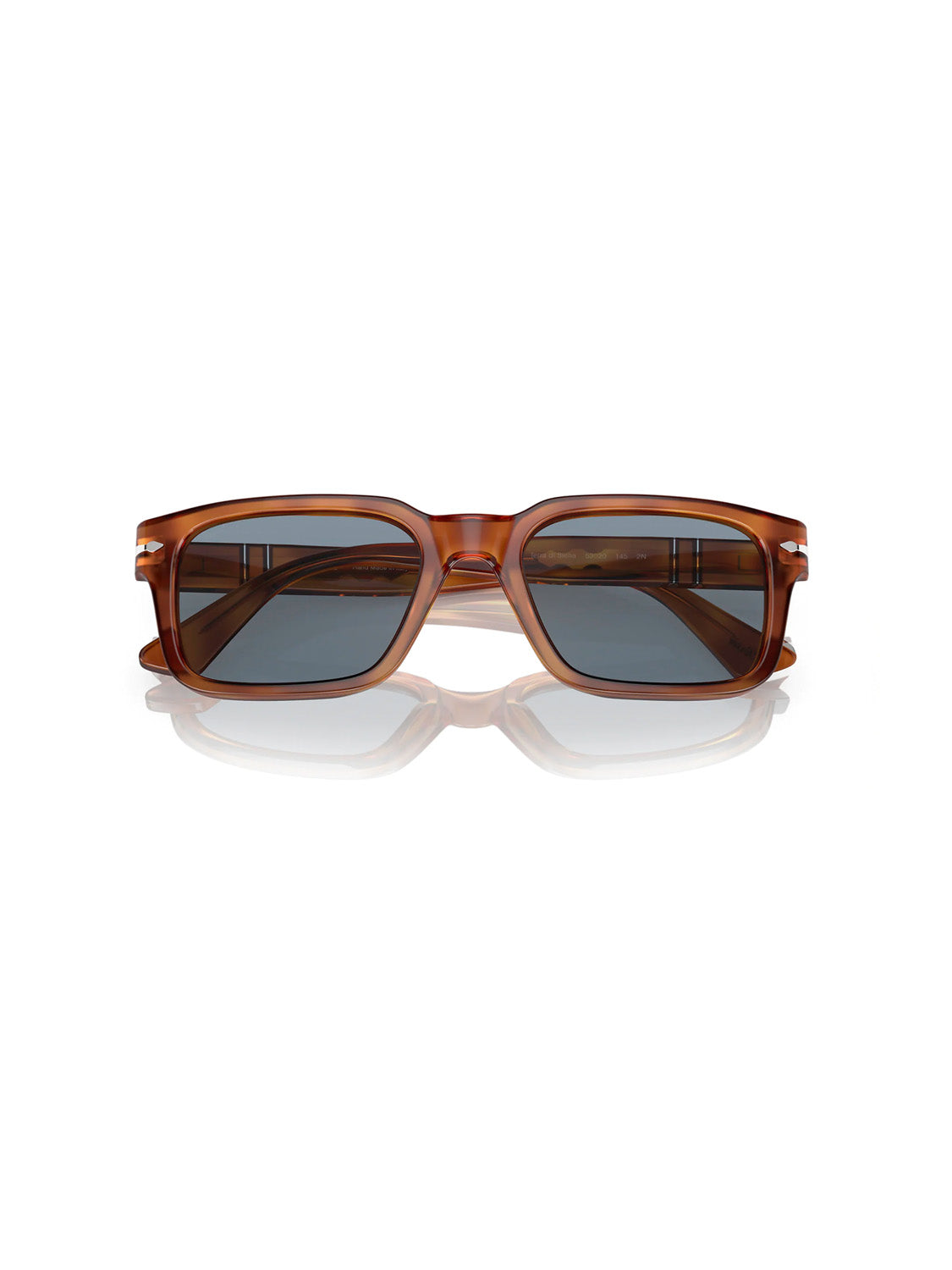 A pair of Persol PO3272 sunglasses, featuring a D-frame silhouette and glossy brown frame with dark lenses, is centered on a white background. They exude modern style and ensure comfort with Persols signature Meflecto system.