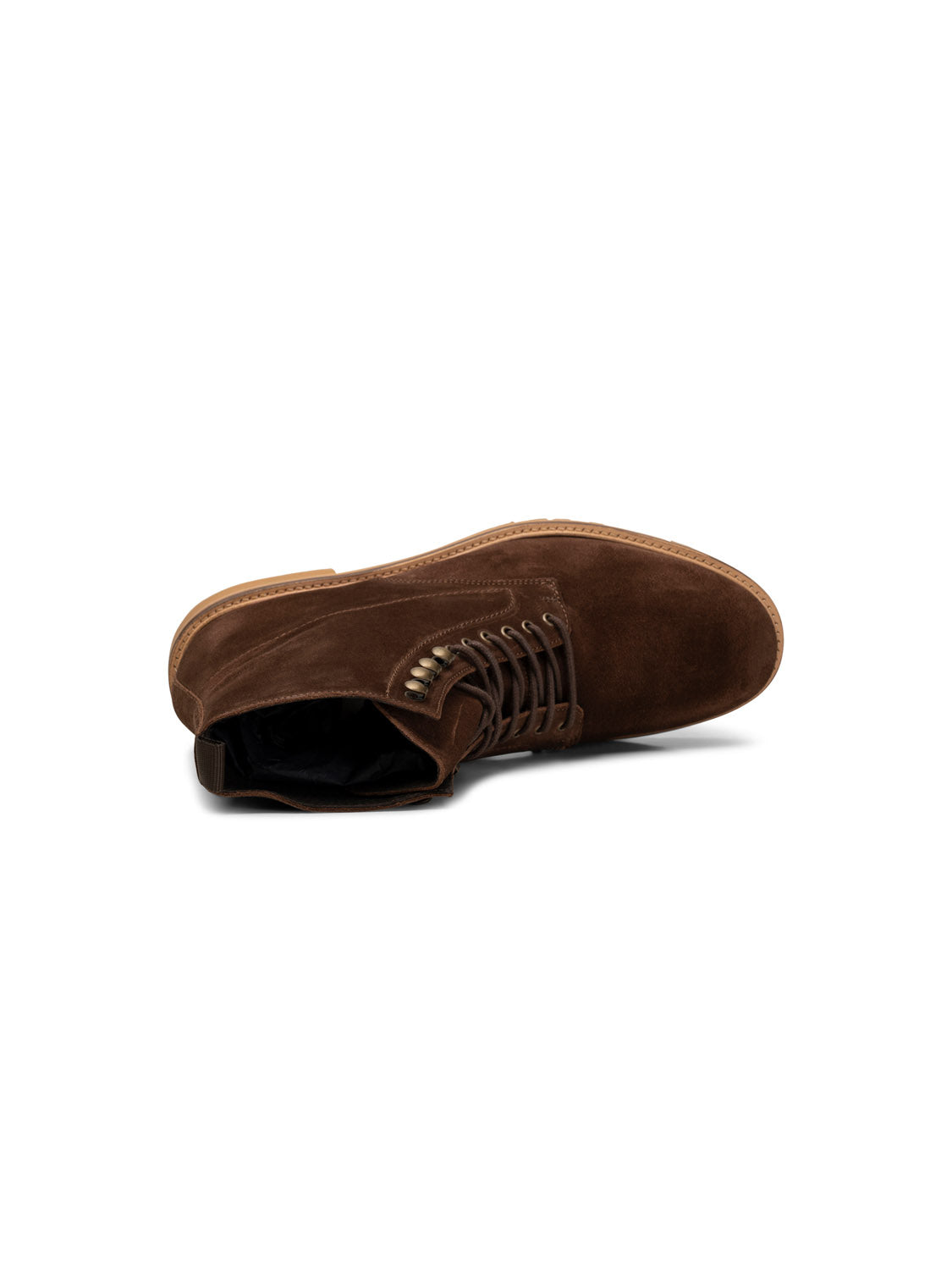The York Suede Lace Up Boot by Shoe The Bear, shown lying on its side, is a brown LWG-certified suede boot with a leather sole and partially unlaced top. Handcrafted in Portugal, it features detailed stitching and a rugged design.