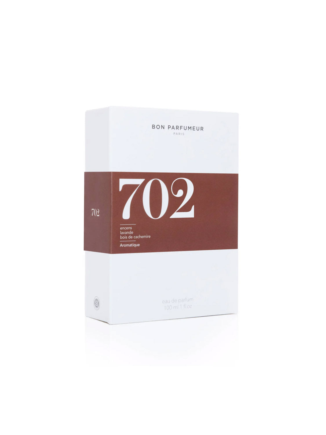 A white rectangular Bon Parfumeur - 702 box displays "Bon Parfumeur Paris" and a brown band listing woody aromatic notes: incense, cedar, and cashmere wood. This 100ml cruelty-free perfume is made in France.