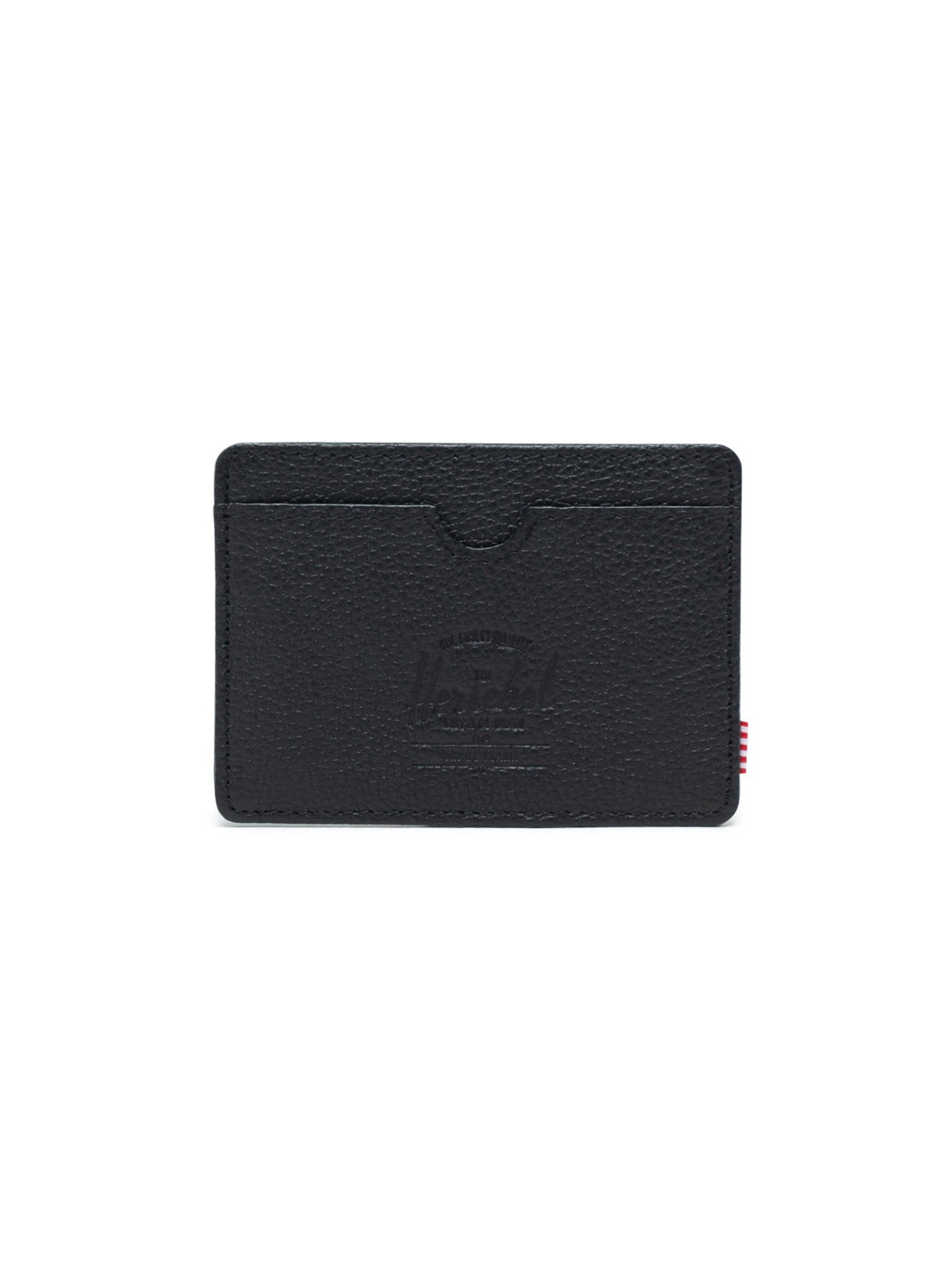 The Herschel Charlie Leather Card Holder Wallet is a compact black leather wallet with RFID blocking, an embossed logo on the front, and a red-and-white striped fabric tag on the right edge, shown against a white background.