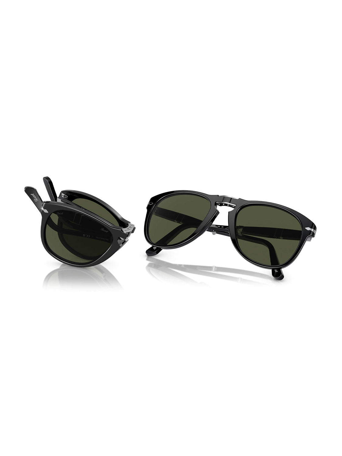 Two pairs of Persol - PO714 sunglasses with acetate frames and dark lenses are on a white backdrop. One pair is folded, the other open, both casting faint reflections below.