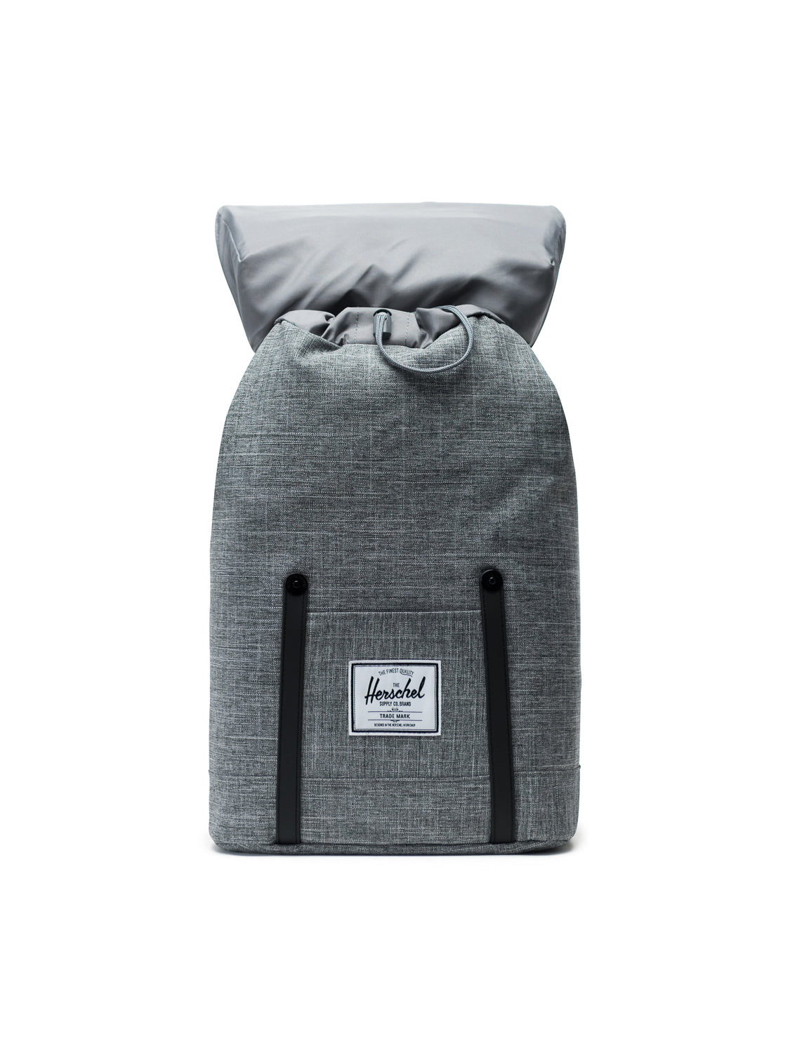 The Herschel Retreat Backpack features grey fabric, a top flap with drawstring closure, black accent straps, a laptop sleeve, and a white rectangular logo patch, shown against a plain white background.