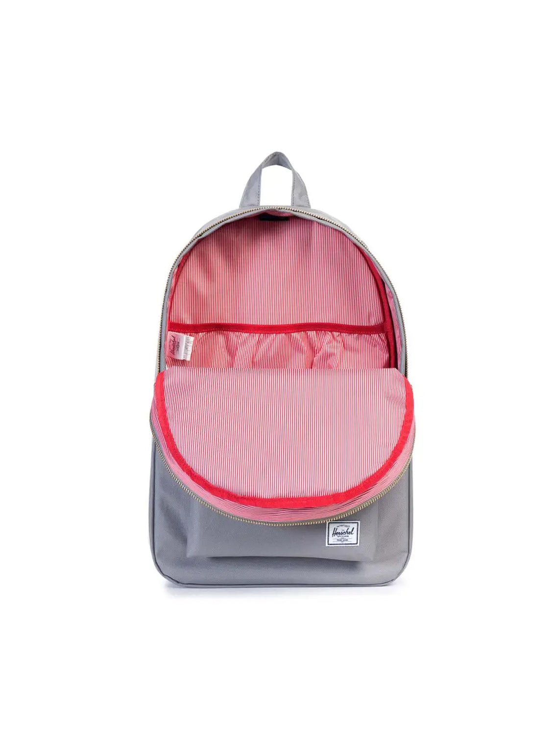 The Herschel Settlement Backpack is a stylish gray bag with its main compartment open, showing a red and white striped interior lining, a laptop sleeve, and a small white label on the lower front.