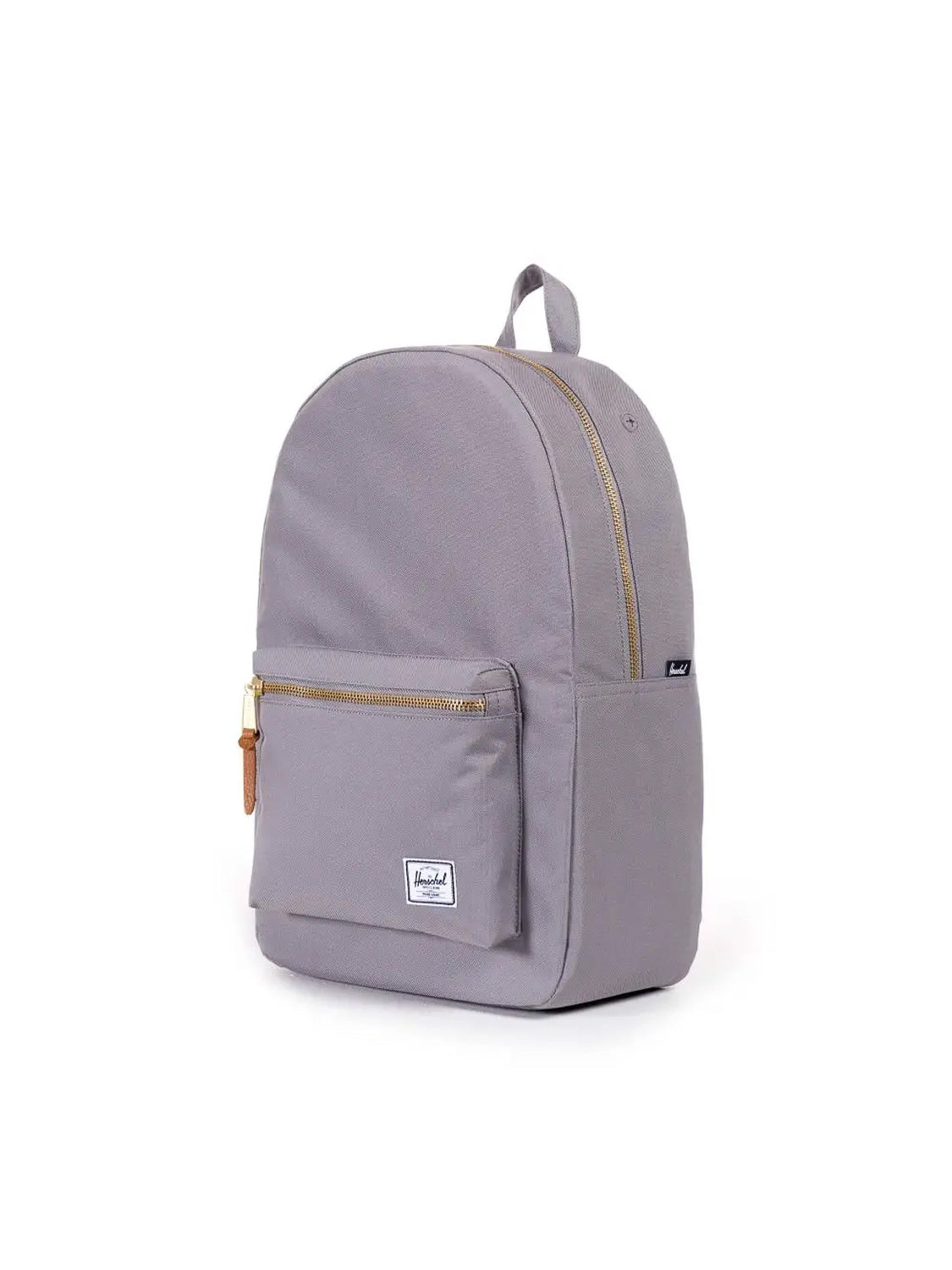 The Herschel Settlement Backpack features a light gray design, front zip pocket, tan zipper pulls, top handle, small white logo patch, and internal laptop sleeve—ideal for a minimal look. Displayed on a plain white background.