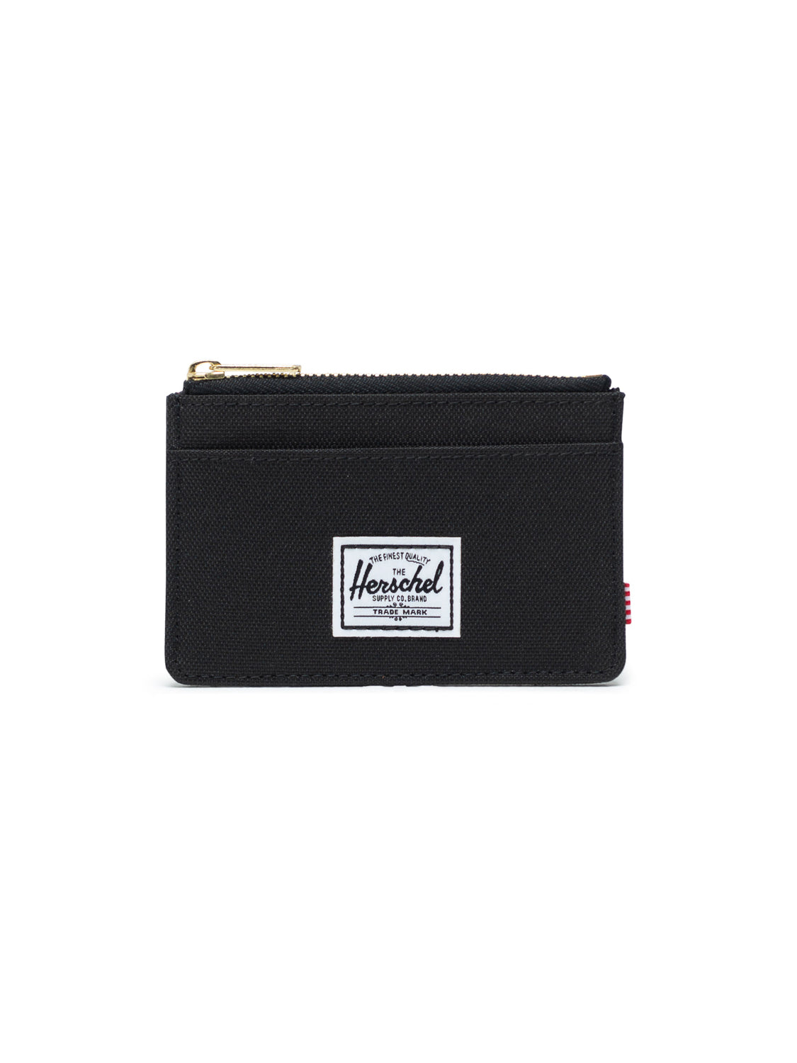 The Oscar Compact Wallet by Herschel is black with a zipper pocket, two card slots, and a white rectangular Herschel label on the front, shown against a plain white background.