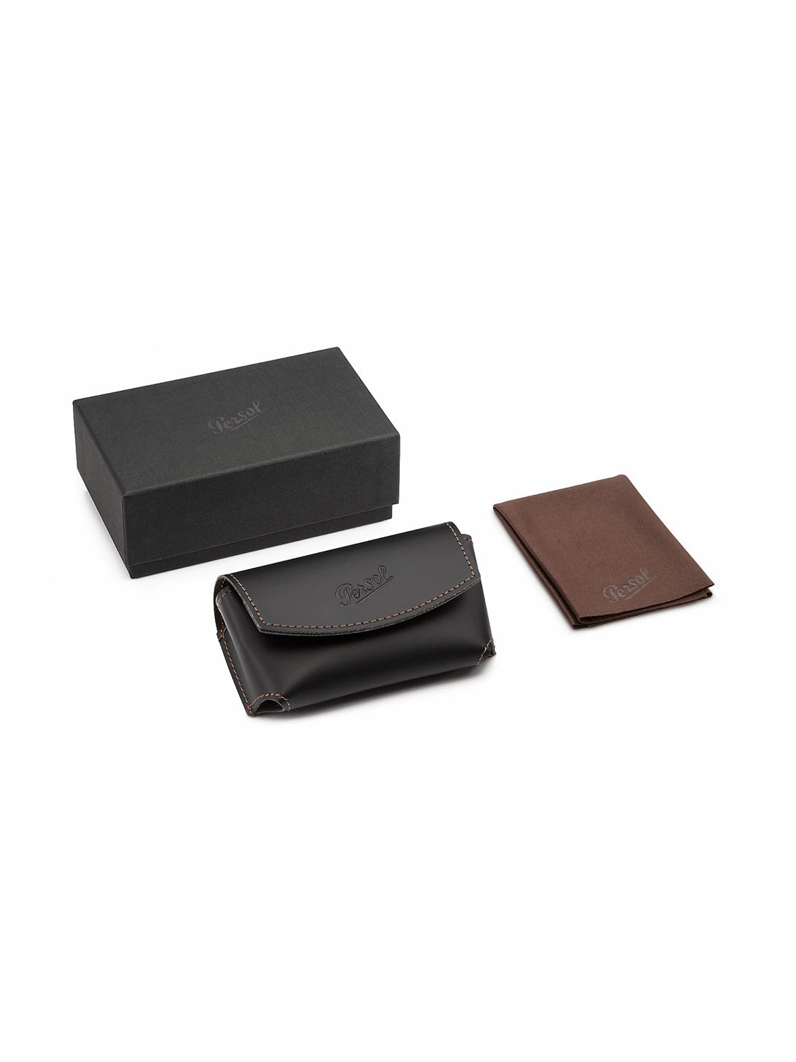 A black leather case with closure, a brown leather card holder, and a black rectangular box are elegantly arranged on a white background. Inside is the stylish Persol - PO714 folding glasses with an acetate frame and crystal lens for ultimate clarity.