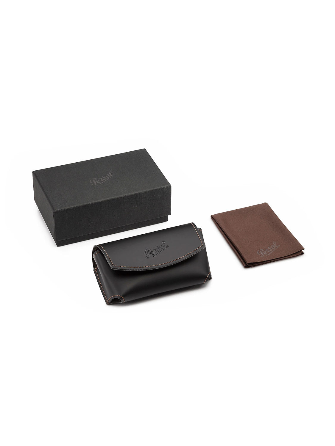 The set features a black rectangular box, a brown leather pouch with stitched edges, and a brown Picard logo folder. Arranged on a white background, its ideal for safeguarding your Persol - PO714 folding glasses or acetate frames.