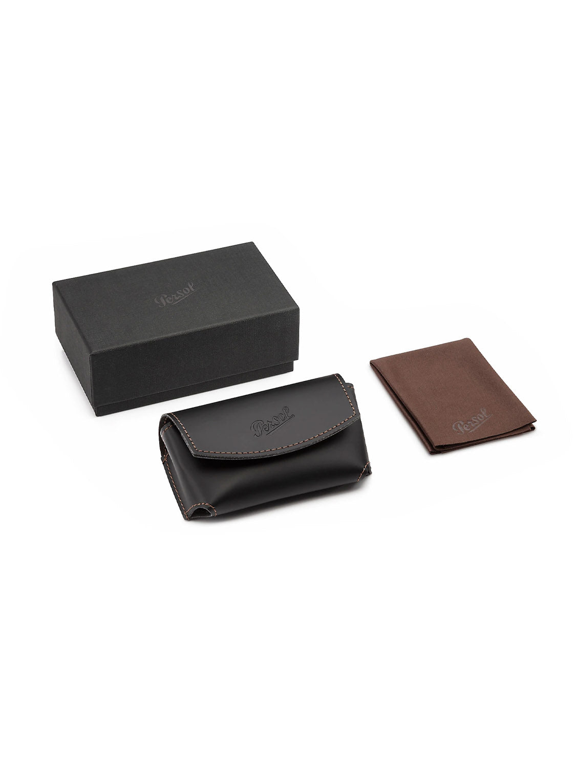 The Persol PO714 set includes a black box, a brown and black leather case with an acetate frame, contrast stitching, and logo imprint, plus a small brown booklet. Ideal for storing your folding glasses or sunglasses with crystal polarized lenses.