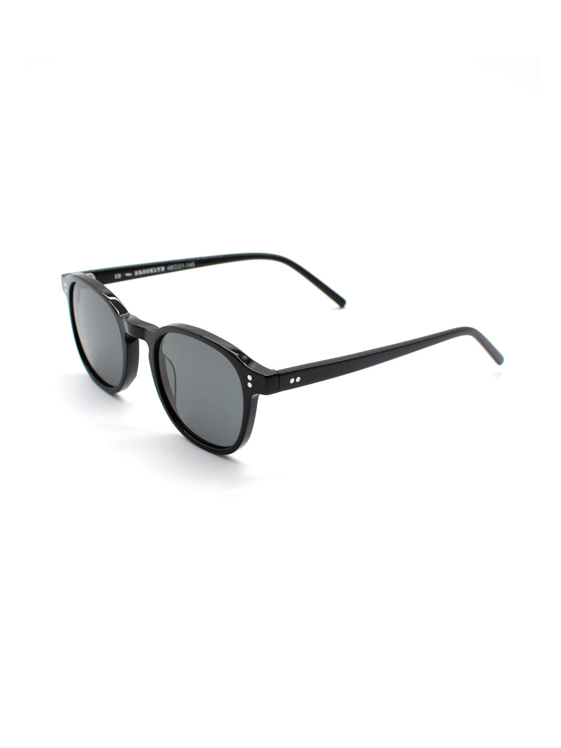 The A144C1G ID Polarized Sunglasses by ID Menswear feature black round frames, dark lenses, and slim arms made from Mazzucchelli Acetate, shown angled on a white background.