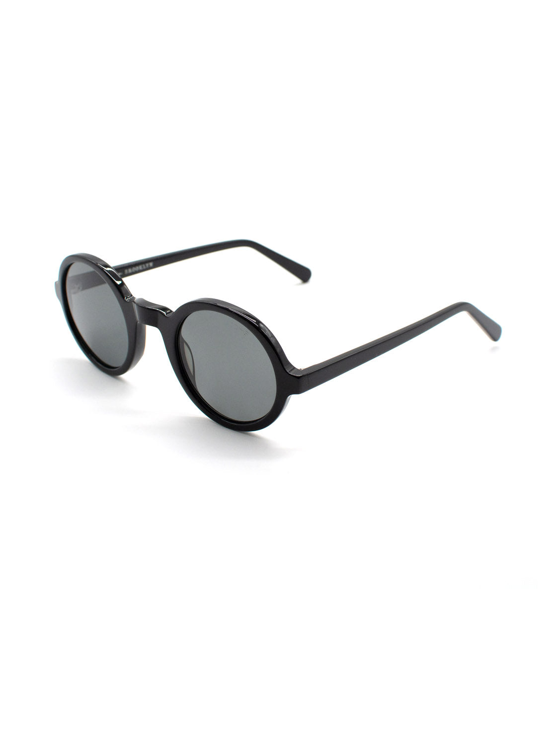 The A308C1G ID Polarized Sunglasses by ID Menswear feature black round frames made from Italian Mazzucchelli Acetate and dark lenses, shown angled on a plain white background.