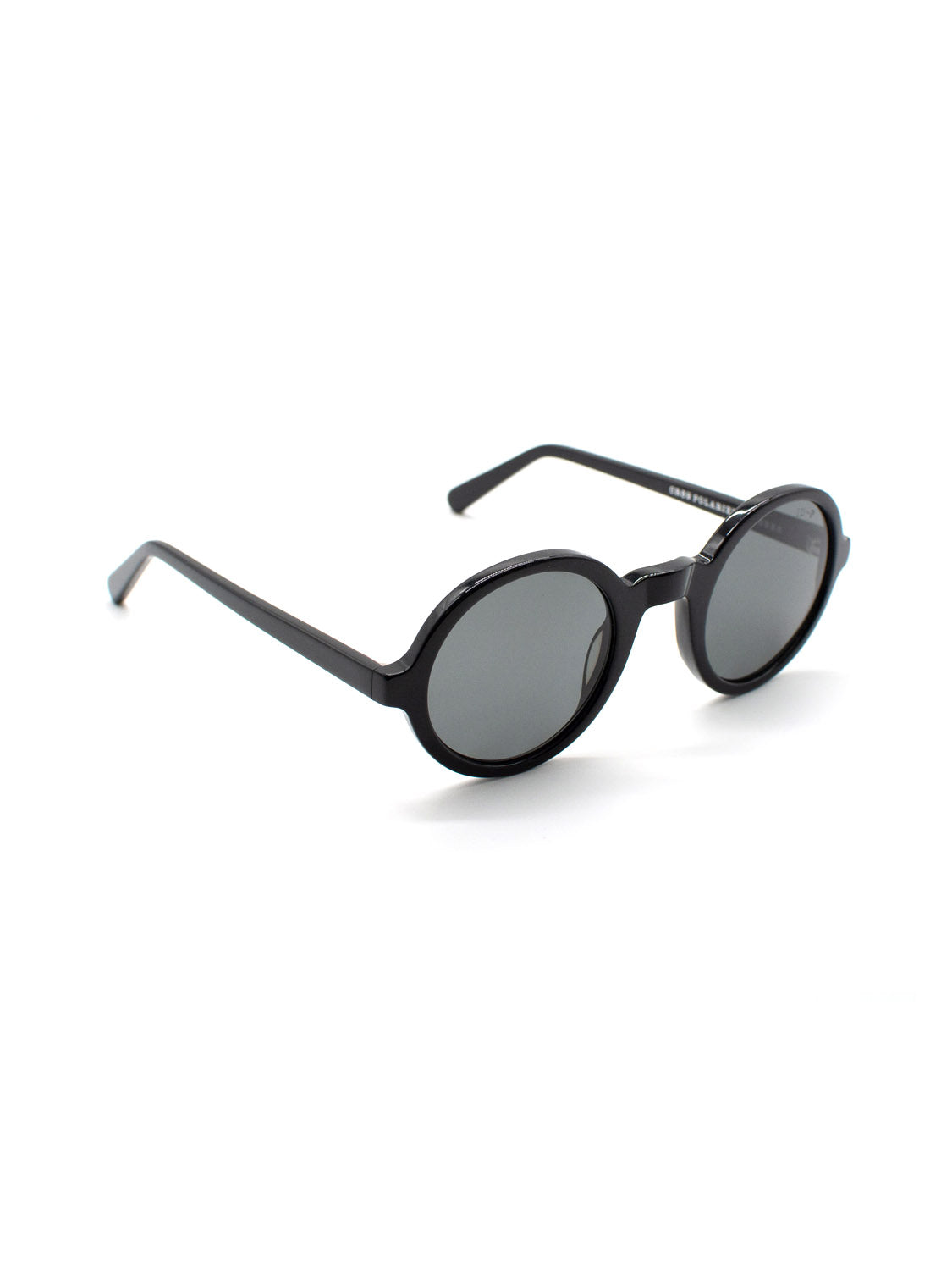 The ID Menswear A308C1G sunglasses feature black, round frames crafted from Italian Mazzucchelli Acetate and CR39 polarized lenses with UV400 protection, shown against a white background.