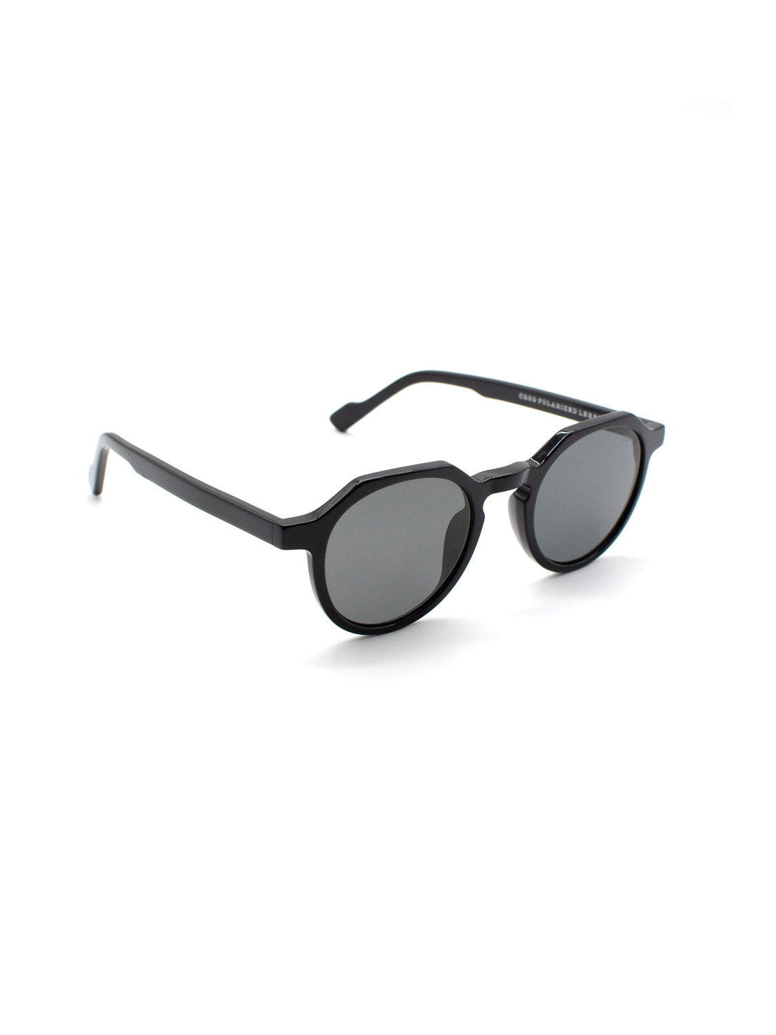 The A343C1G ID Polarized Sunglasses by ID Menswear feature black round Mazzucchelli Acetate frames, dark UV400 lenses, and slightly angled arms for a modern look, shown on a white background.