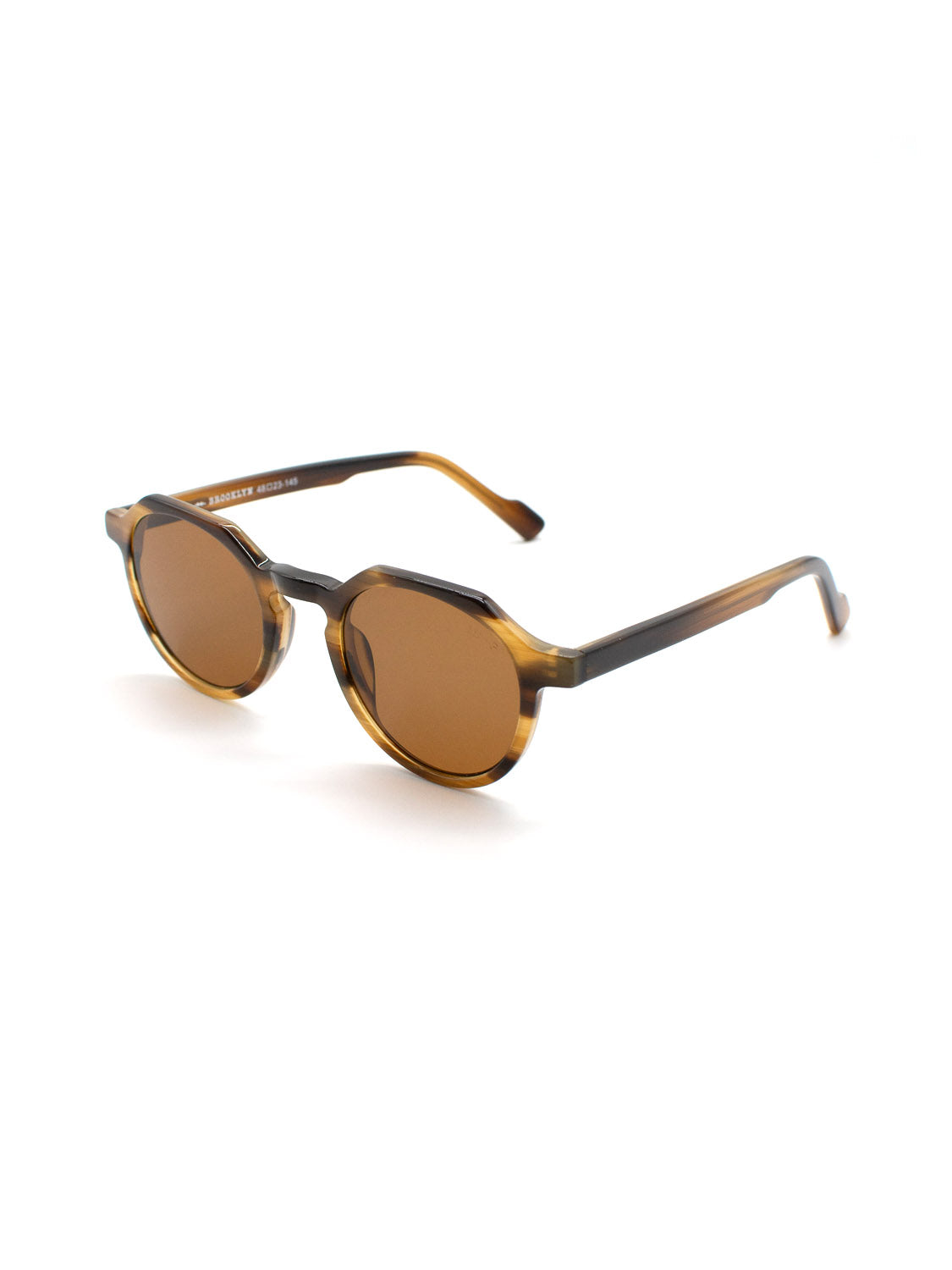 The A343C35B ID Polarized Sunglasses by ID Menswear feature a tortoiseshell round frame in premium Mazzucchelli Acetate, brown CR39 polarized lenses with UV400 protection, and a keyhole bridge, shown on a white background.